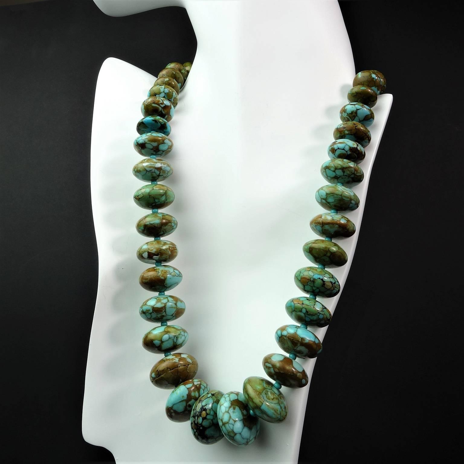 Graduated, Polished rondels of patterned Turquoise, accented with small blue seed beads. 
Size: graduated up to 20mm
Length: 19 inches
Clasp: silver tone
More from this seller by putting gemjunky into 1stdibs search bar.

