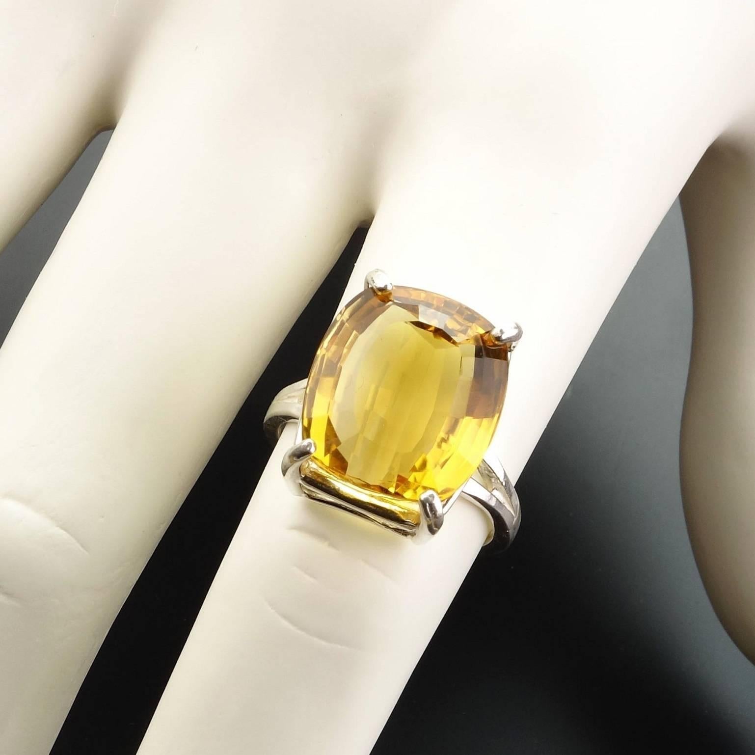 Sparkling, Brazilian step cut, cushion shape Citrine in fabulously bright flashing gold set in Sterling Silver ring. Lovely 9.87 carat Citrine with so much life,  that we found on one of our  Brazil trips.  Size 7. Citrine is the November birthstone.