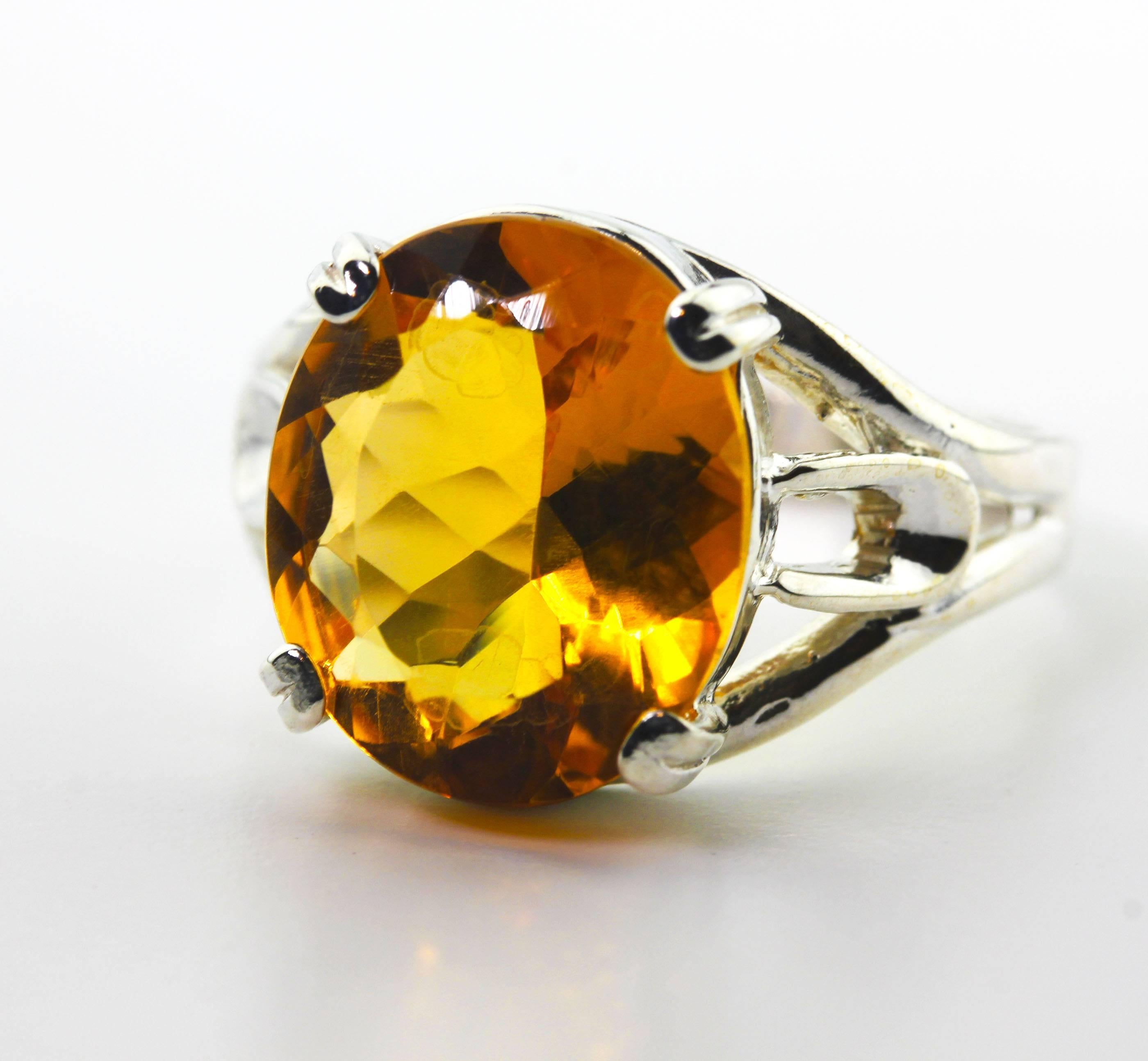 Brilliant gold color natural 5.89 carat clear Brazilian Citrine (14.18 mm x 12.18 mm) set in a sterling silver ring size 9 (sizable).