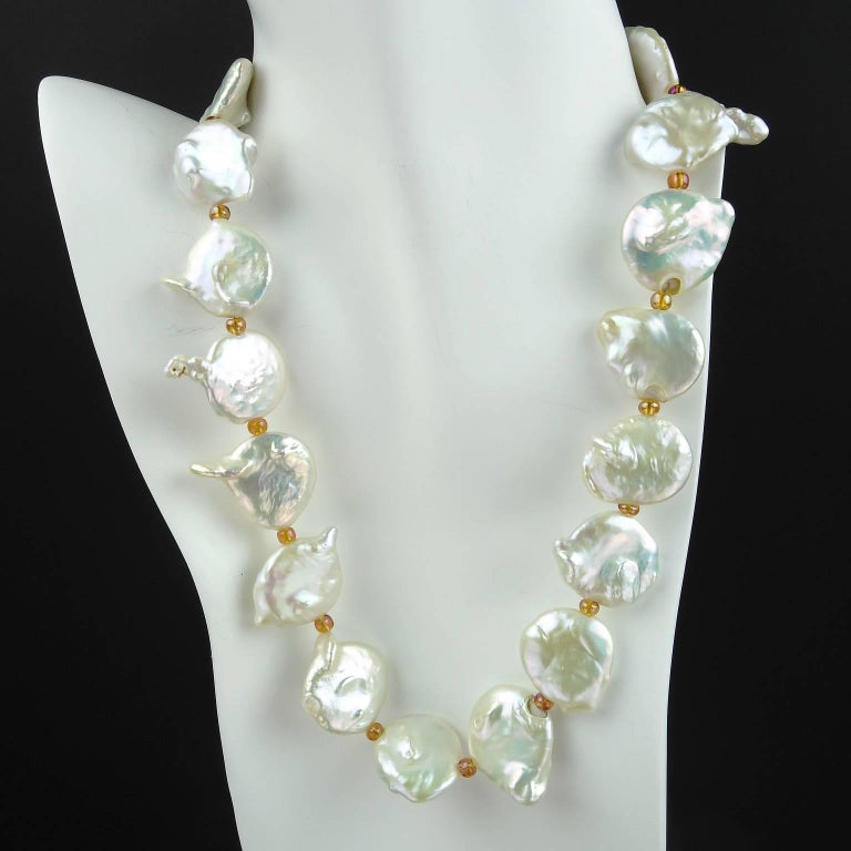 Distinctive Necklace of Large (20-22mm) White, Irregular Coin Pearls spaced with sparkly gold/bronze czech beads and finished with a coordinating pearl clasp. This lovely coin pearl necklace sits flat and at 19inches is the perfect length. A pearl