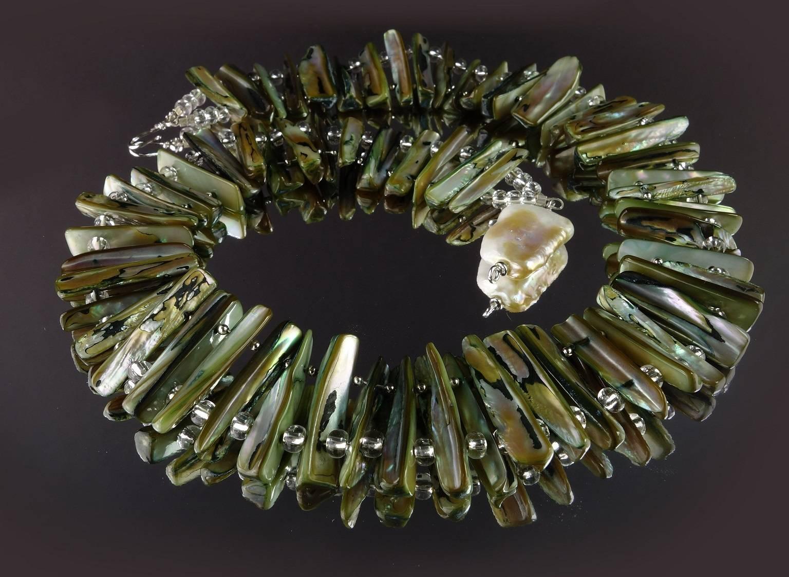 WOW! Fabulous Mother of Pearl Collar with Sparkly Silver Czech crystal spacers. Wear this out on the Town and be the Talk of the Town! The Mother of Pearl measures 28 x 5mm. The entire length of the collar is 22inches. Secured with large Baroque
