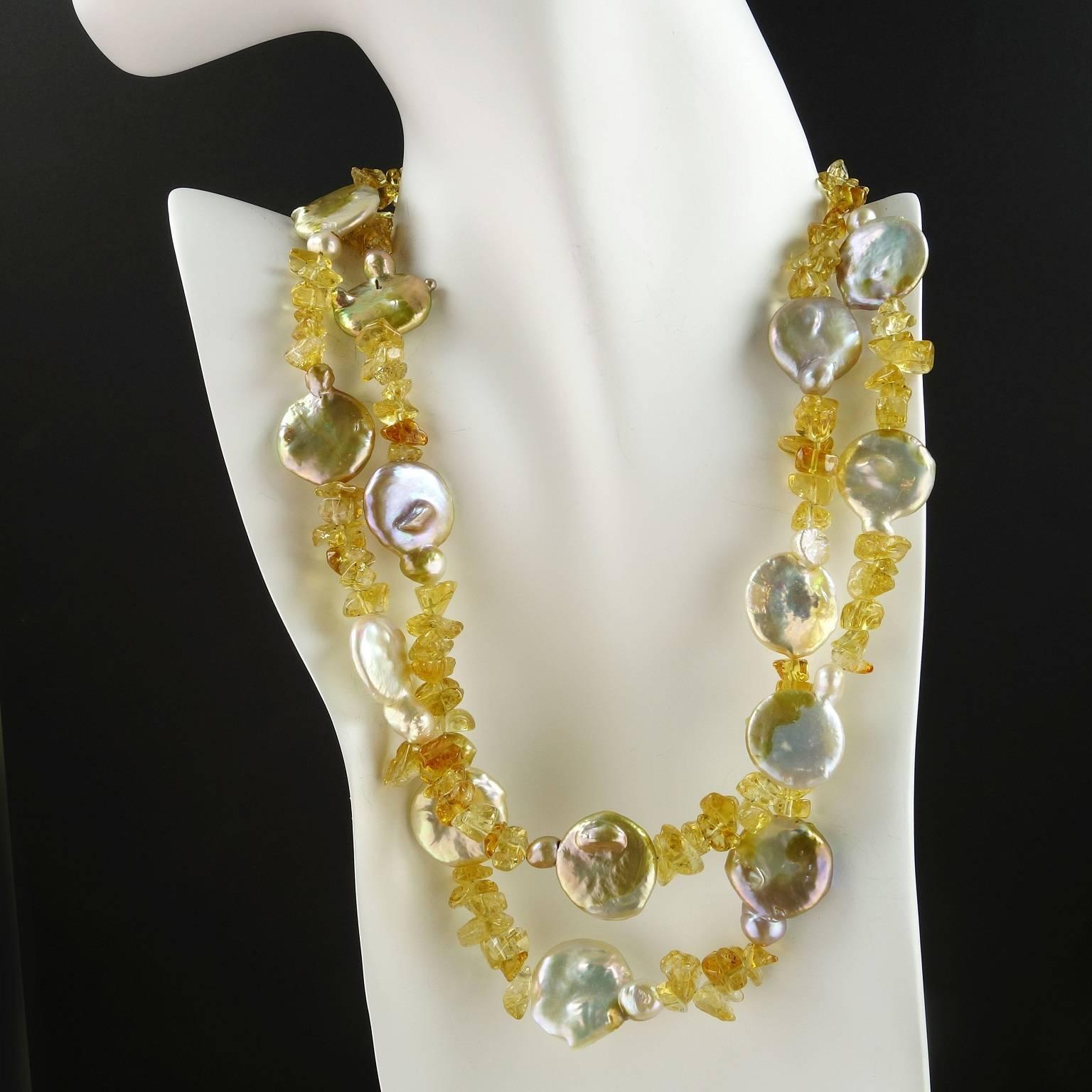 Two strand iridescent Coin Pearl and Polished tumbled golden Citrine chip necklace.  This lovely feminine necklace is a perfect match up of coin pearls with iridescent flashes of brown/ gold/mauve and tumbled golden citrine.  It is secured with a