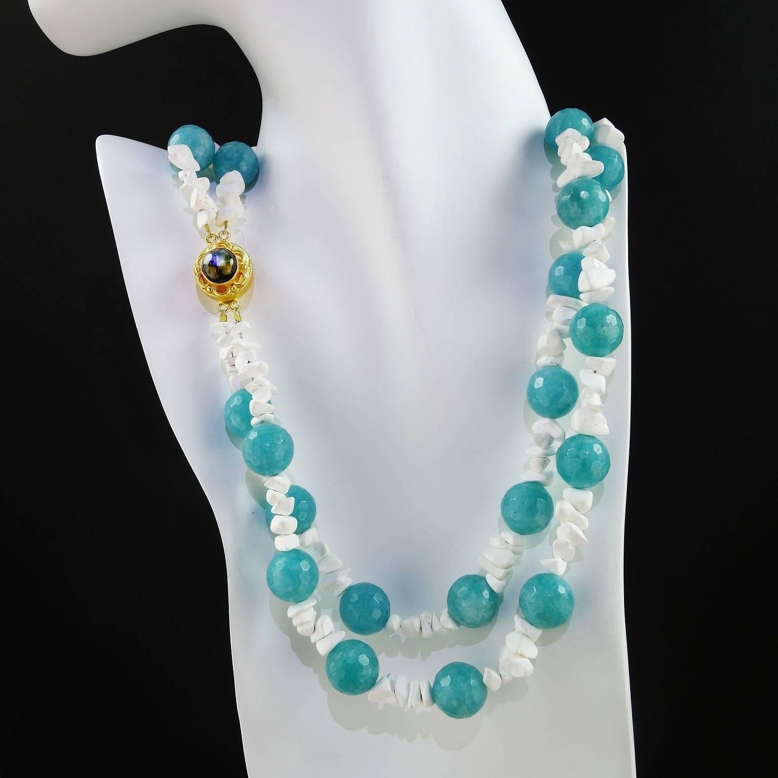 Double strand necklace of Blue dyed faceted agate balls and chips of white magnesite.  The agate is medium blue leaning towards teal and the Gold tone clasp features a labradorite cabochon.  The necklace is a comfortable 19 inch length and you can