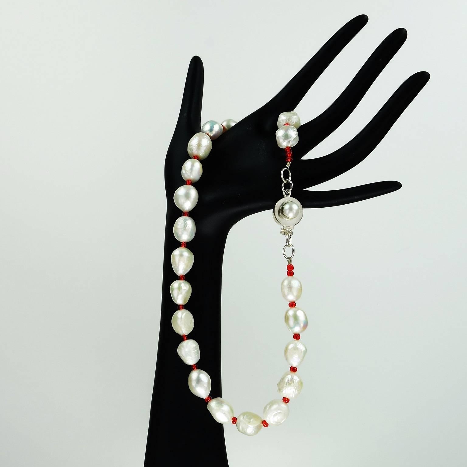 Lovely White Freshwater Pearl Necklace with Red Czech bead accents. This choker length (17.5in) necklace has a complementary silver tone clasp with a pearl nestled in it. Wonderful and fresh for all seasons, but looking great for the approaching