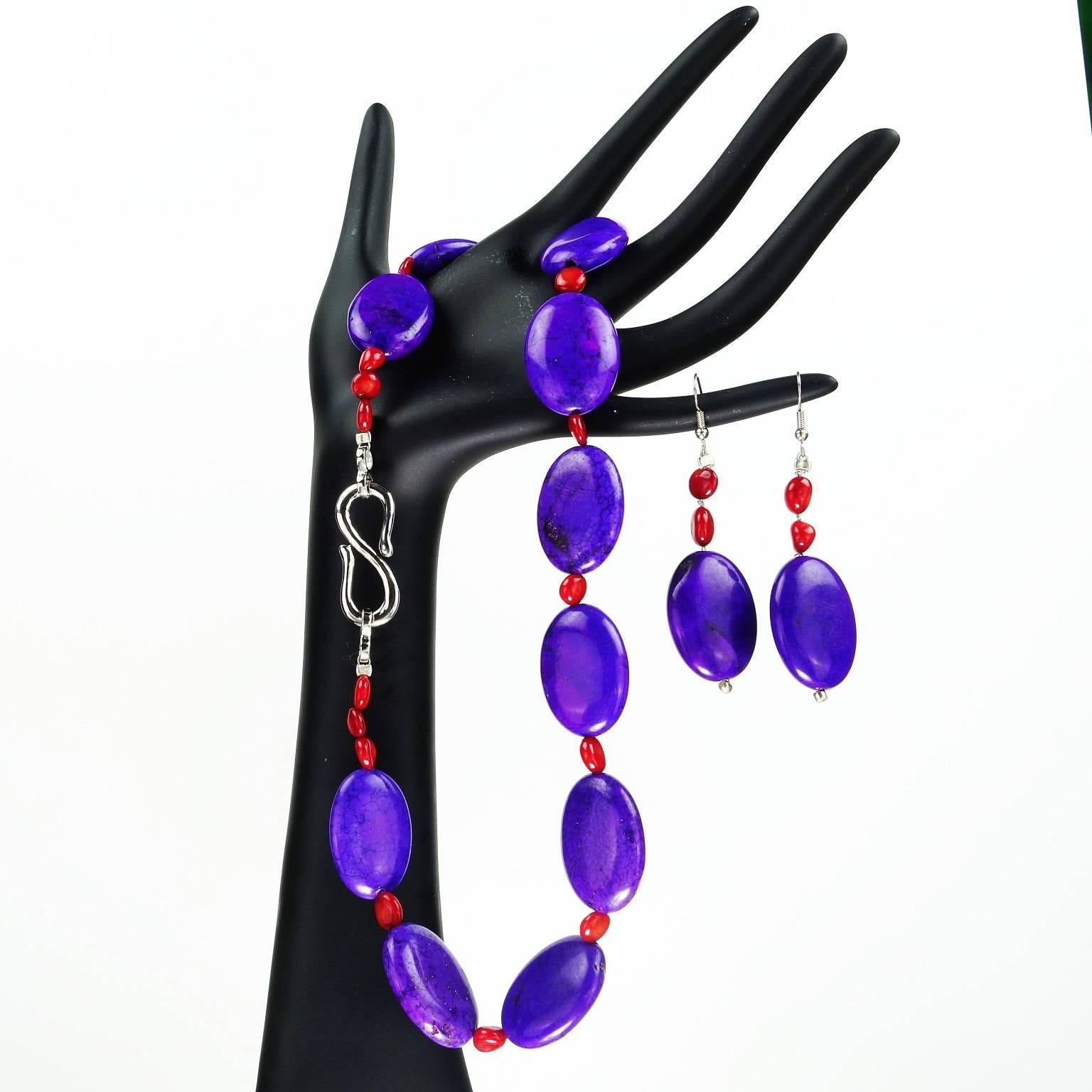 Unique Bright purple oval beaded necklace with coral accents and matching earrings. Dyed purple magnesite pops with orange coral- great colors for a cruise or the warmer climates! Silver-tone S clasp closure. Great price point for such a strong look.