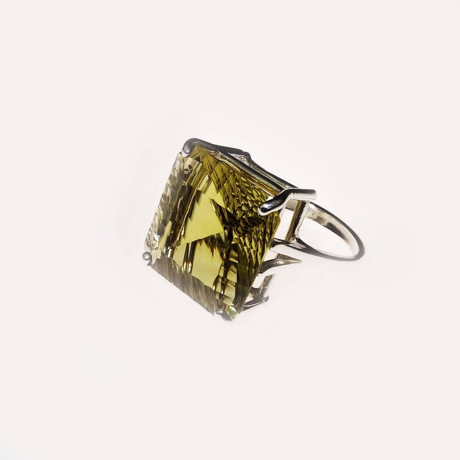 Custom made, large (16x16mm) square Brazilian Fancy Cut Green Gold Quartz & Sterling Silver Ring. I found this gemstone in Ouro Preto, Minas Gerais, Brazil and had to have it. I think it is unique and stunning. I set it with a simple setting so that