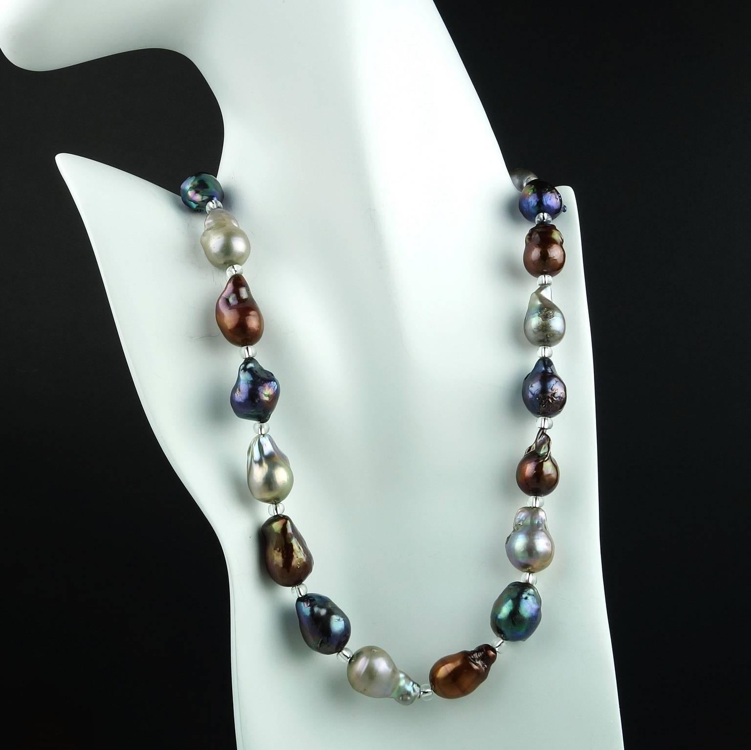 This is a Single Strand of Multi Color Freshwater Baroque Pearl Necklace in Deep rich tones of gray (with purple and teal), lighter gray, and brown. All the pearls have wonderful iridesence. They are accented with Silver Czech beads and a silver