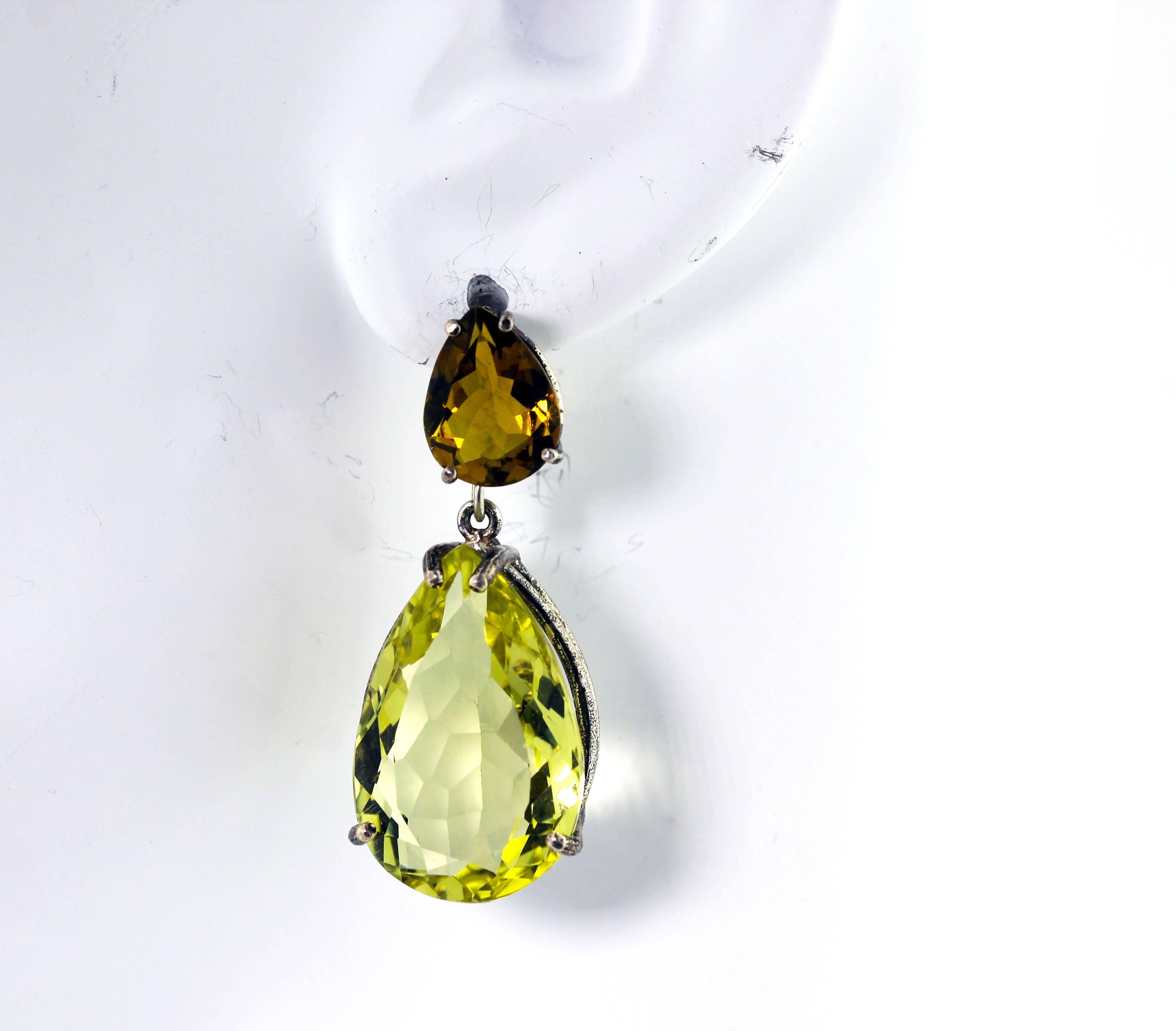 37 carats of brilliant Lemon Quartz dangle wonderfully from these 5.65 carats of glittering orangy-yellow Tourmalines set in Sterling Silver stud earrings.  They measure 1.5 inches long.