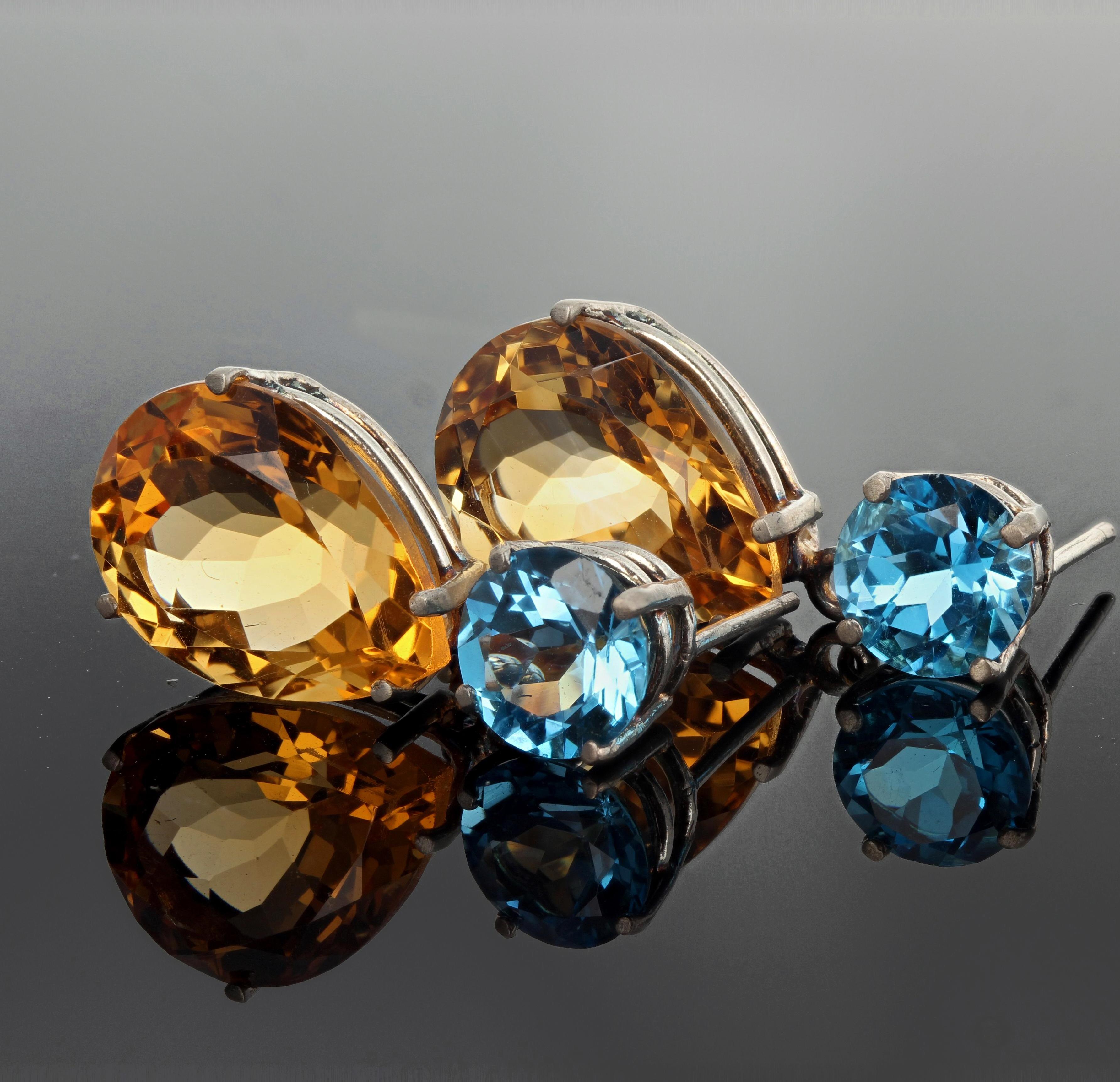 2.28 carats each brilliant blue Topaz (8 mm) dangle elegantly the 3.31 carats each of gorgeous pear cut Citrines (16 mm x 12 mm).  They measure one inch long.  More from this seller by putting gemjunky into 1stdibs search bar.