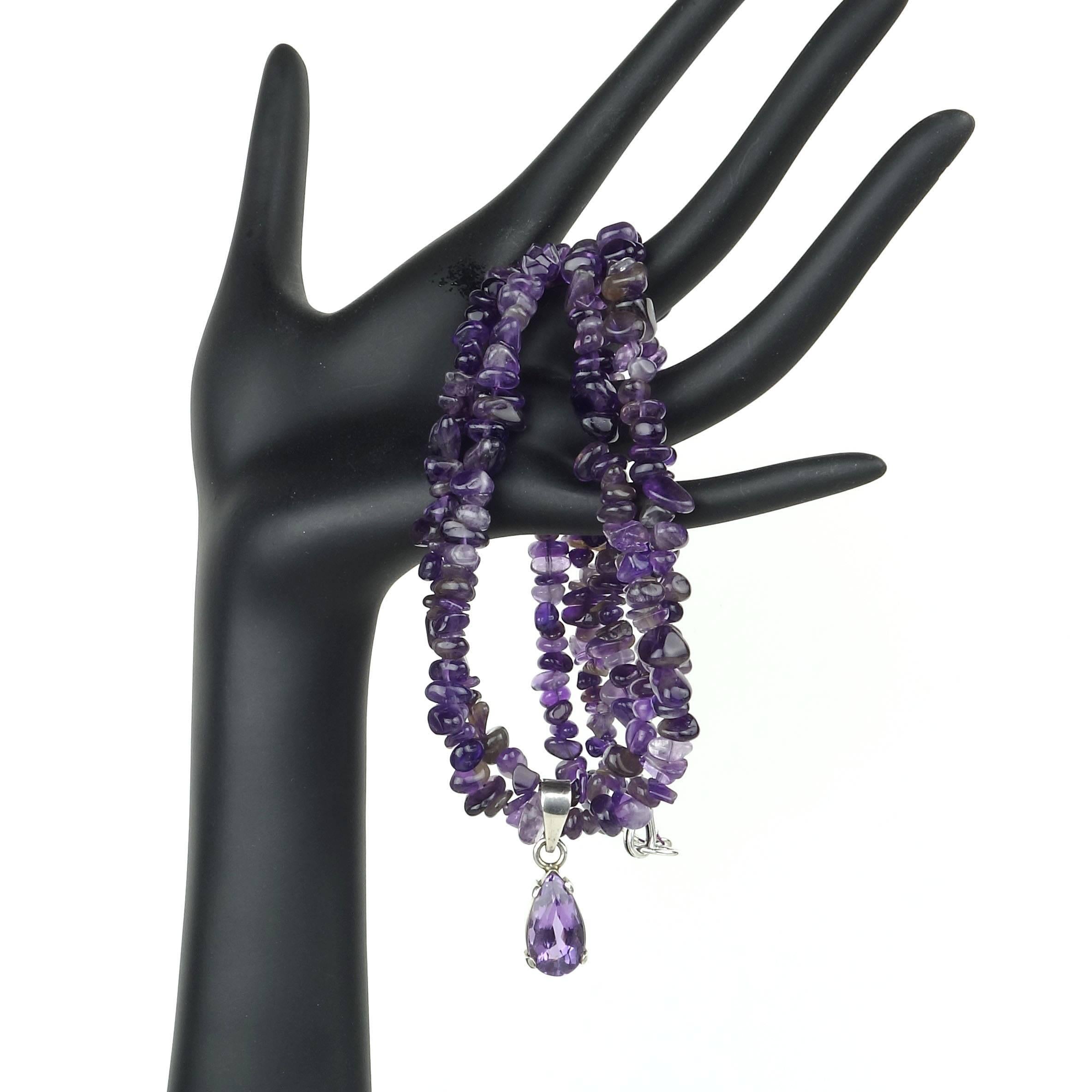 Custom made, sparkling, long pear shaped Amethyst in deep Sterling Silver bezel setting hanging from a necklace of two strands of highly polished tumbled Amethyst. The handmade pear shape focal is set in a deep bezel and wide bail emphasizing the