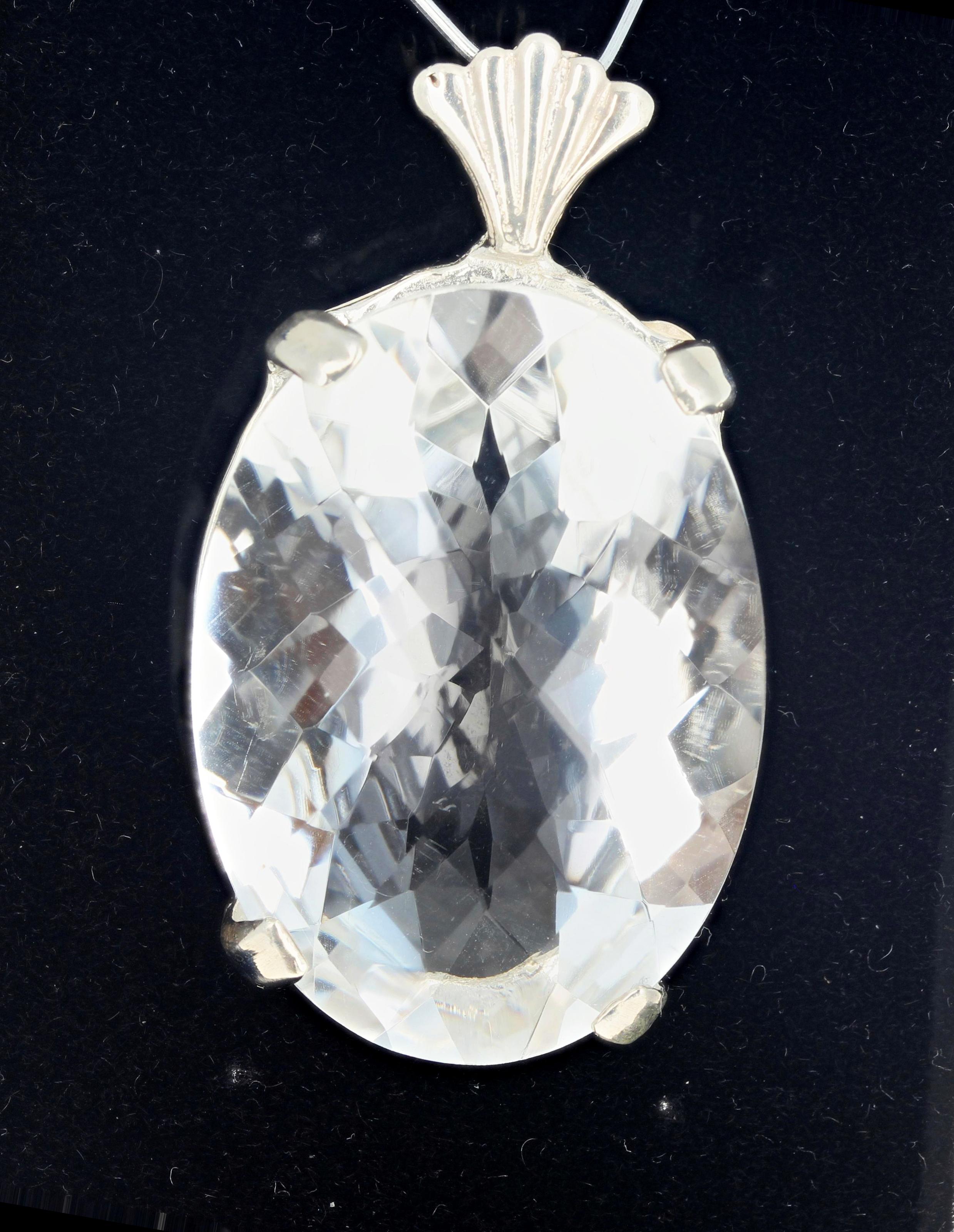 Fabulously sparkling huge 85 Carat silvery white translucent (no visible inclusions whatsoever) checkerboard gem cut Quartz set in a sterling silver pendant.  The gemstone is 37 mm x 27 mm and looks wonderful with all colors.  And looks wonderful
