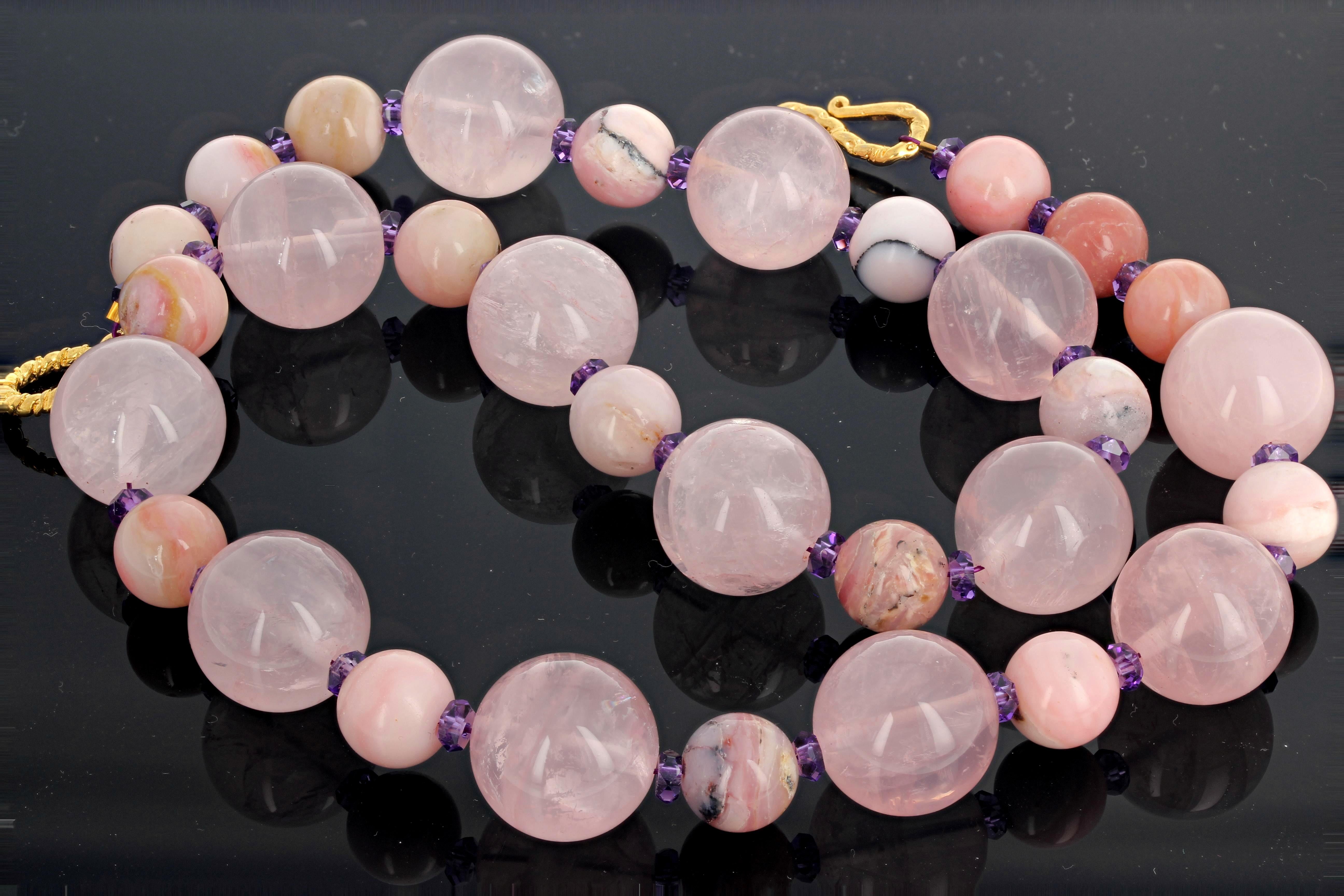 Natural glowing lively Rose Quartz (16 mm) is adorned with natural rare pink Peruvian Opals and sparkling purple Amethyst accents set with a gold plated clasp and is 19 inches long.  This goes elegantly from daytime to evening.  