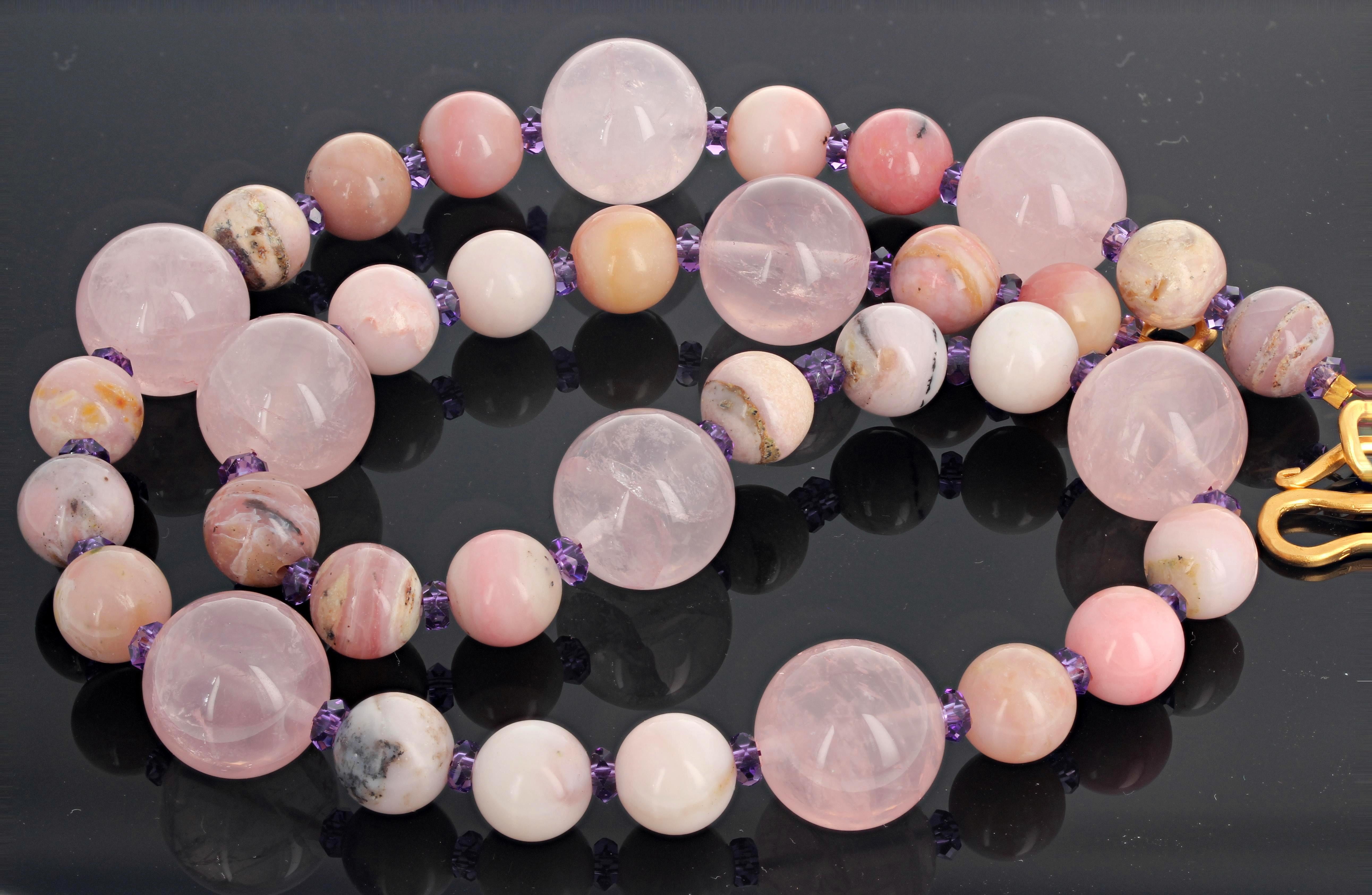 Splendid pink pink pink rose Quartz glows translucently enhanced with rare natural pink Peruvian Opals accented with sparkling Amethysts set with a hammered gold plated clasp.  This is 20.25 inches long.  