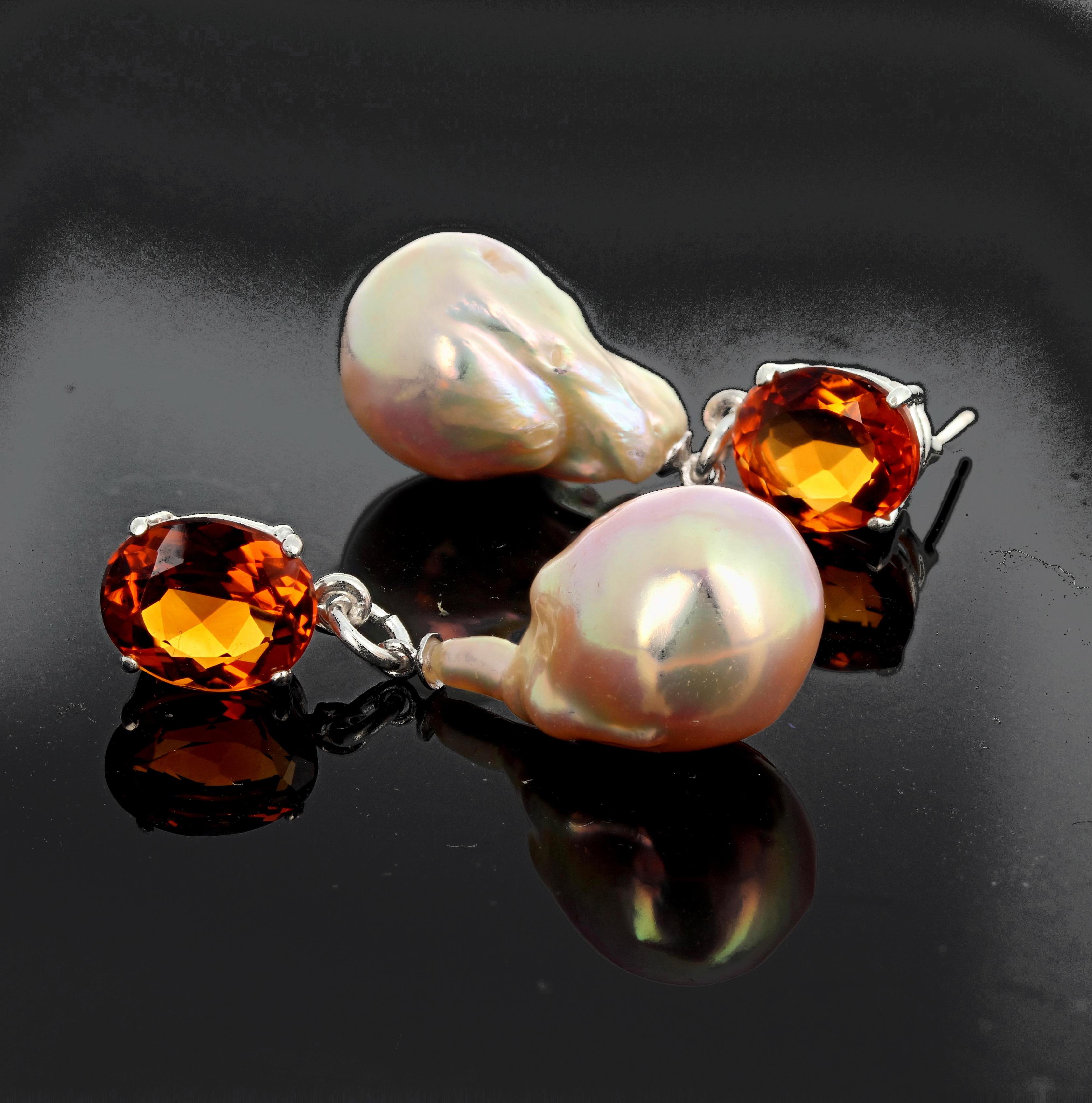 Glittering brilliant 6 carats total of matching oval Citrines cast their reflection on dangled goldy glowing cultured baroque Pearls on sterling silver stud earrings.  They hang approximately 1.53 inches long.  