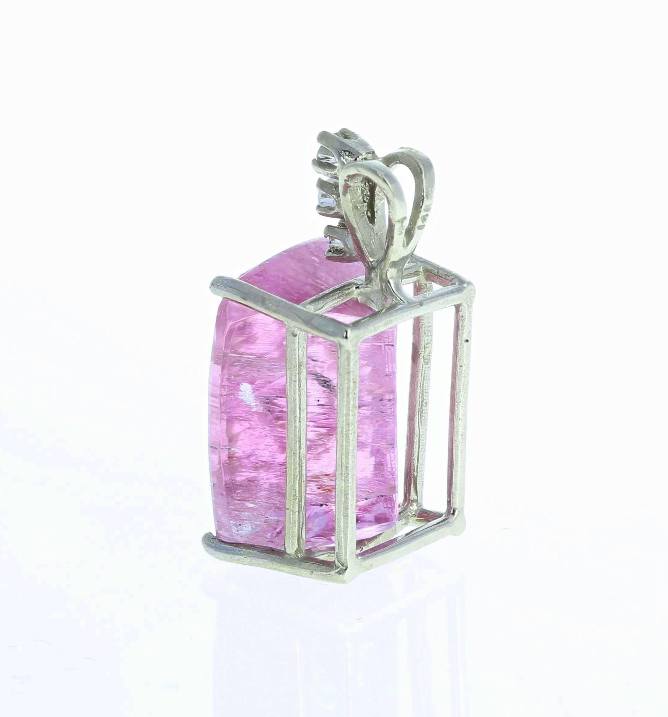 Glittering unique pinkypurple natural Brazilian cushion cut Kunzite (19.9 mm x 15.4 mm) enhanced with sparkling white diamonds set in a 14Kt white gold enhancer pendant.  Spectacular optical effect in the Kunzite exhibits pink reflections and fire