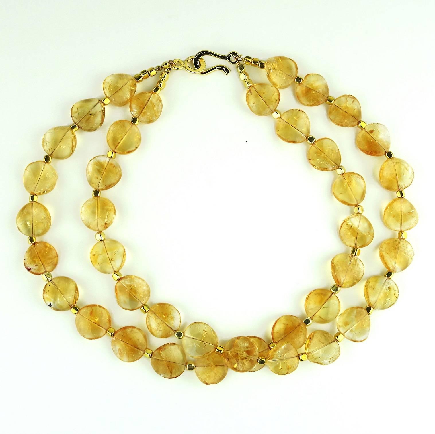 Double strand necklace of 16MM wavy Citrine discs with gold tone accents. This 17.5 inch necklace lays beautifully on your neck as is or can be gently twisted to create a choker.  It is secured with a vermeil hook and eye. Citrine is the November