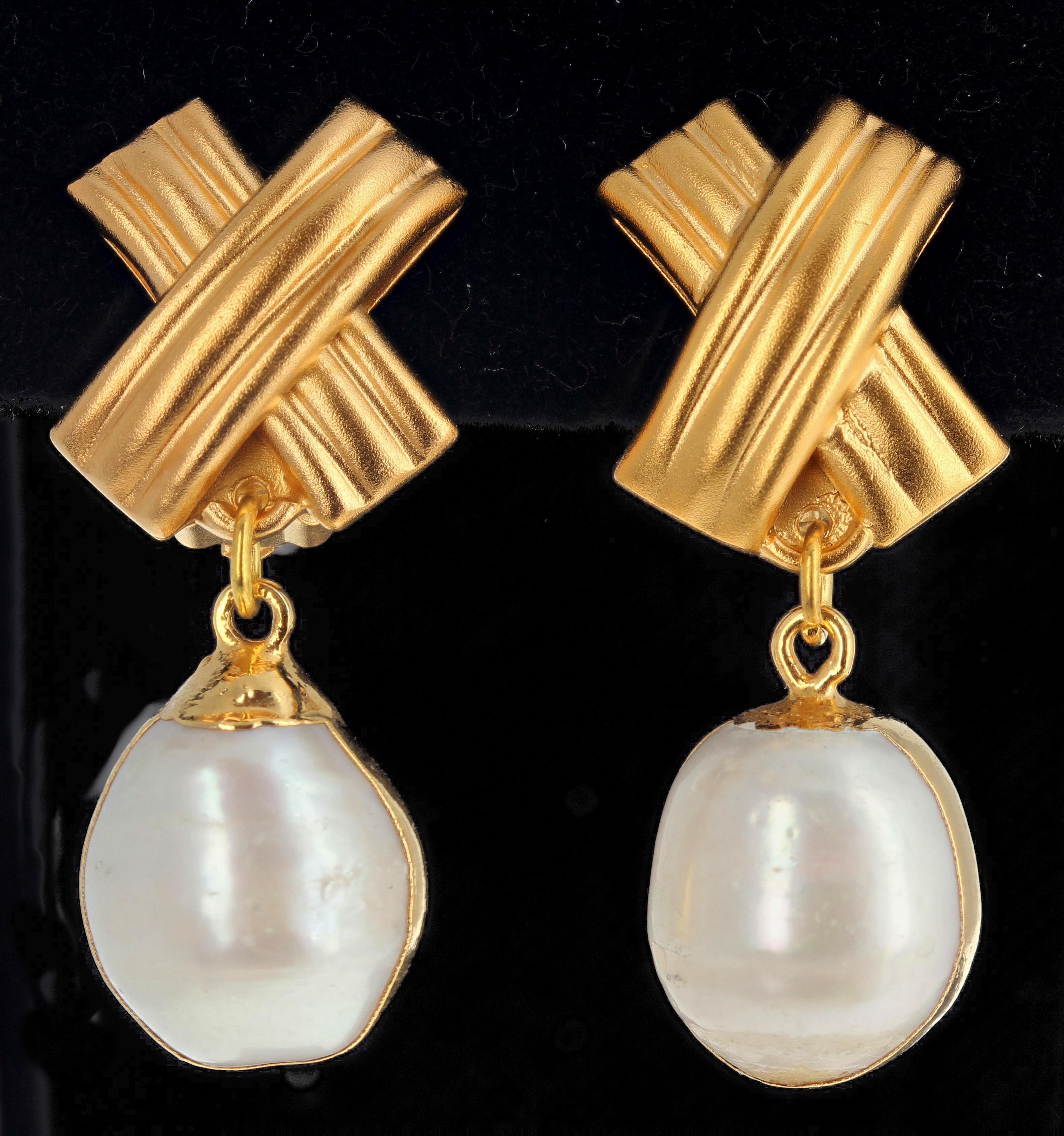 Elegant dangling Vermeil (gold plated sterling silver) Pearl clip-on earrings.  They dangle approximately 1.7 inches from top of clip-on to bottom of Pearl.  These are great for daytime into evening ! 