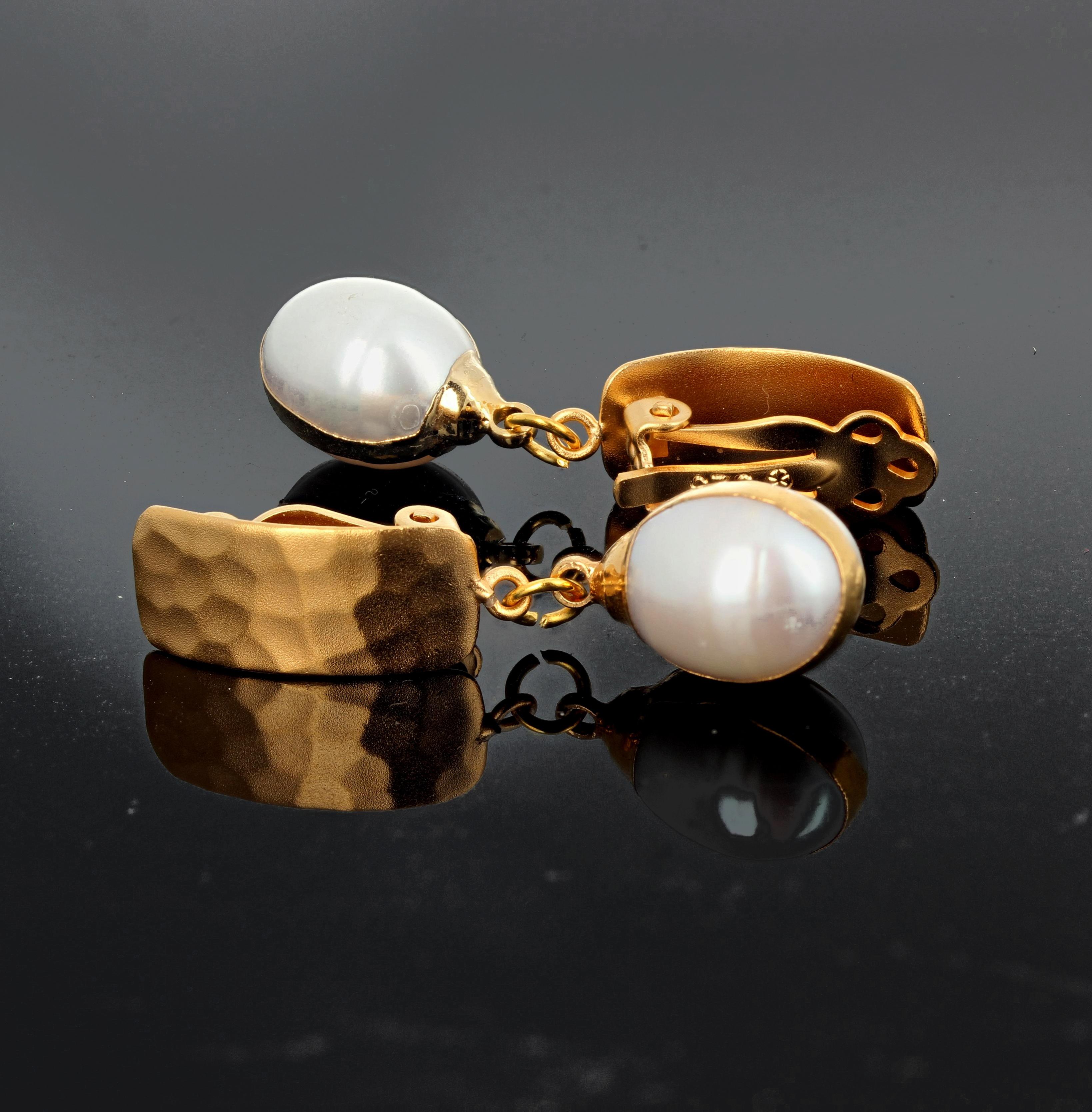 Elegantly dangling white Pearls swing from this Vermeil (gold plated sterling silver) clip-on earrings that hang approximately 1.5 inches from top of clip to bottom of pearl.  More from this seller by putting gemjunky into 1stdibs search bar.