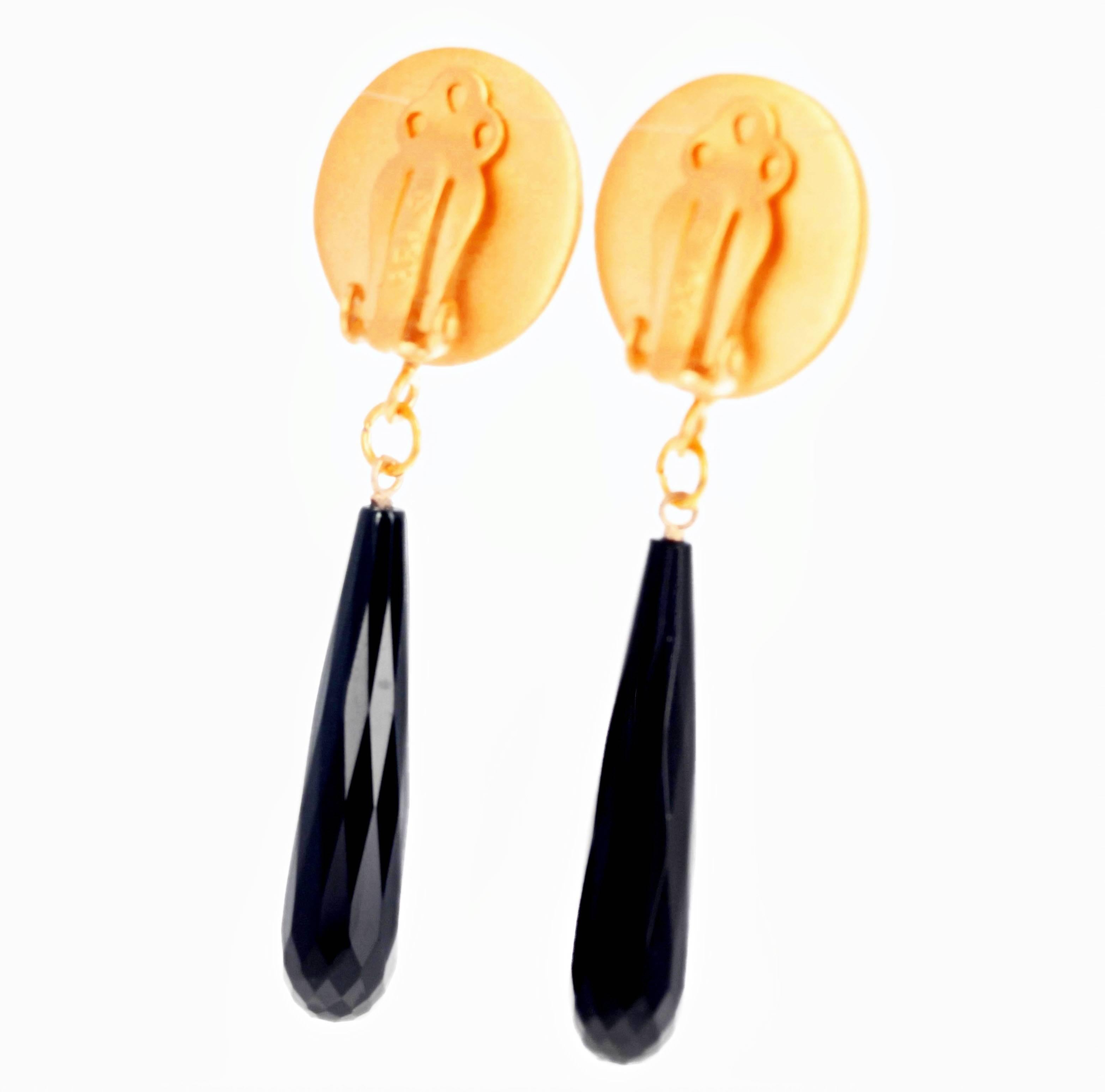 Checkerboard gem cut impressive Black Onyx dangle elegantly from these vermeil (gold plated sterling silver) clip-on earrings that hang approximately 2.2 inches long from top of clip-on to bottom of Onyx. 
