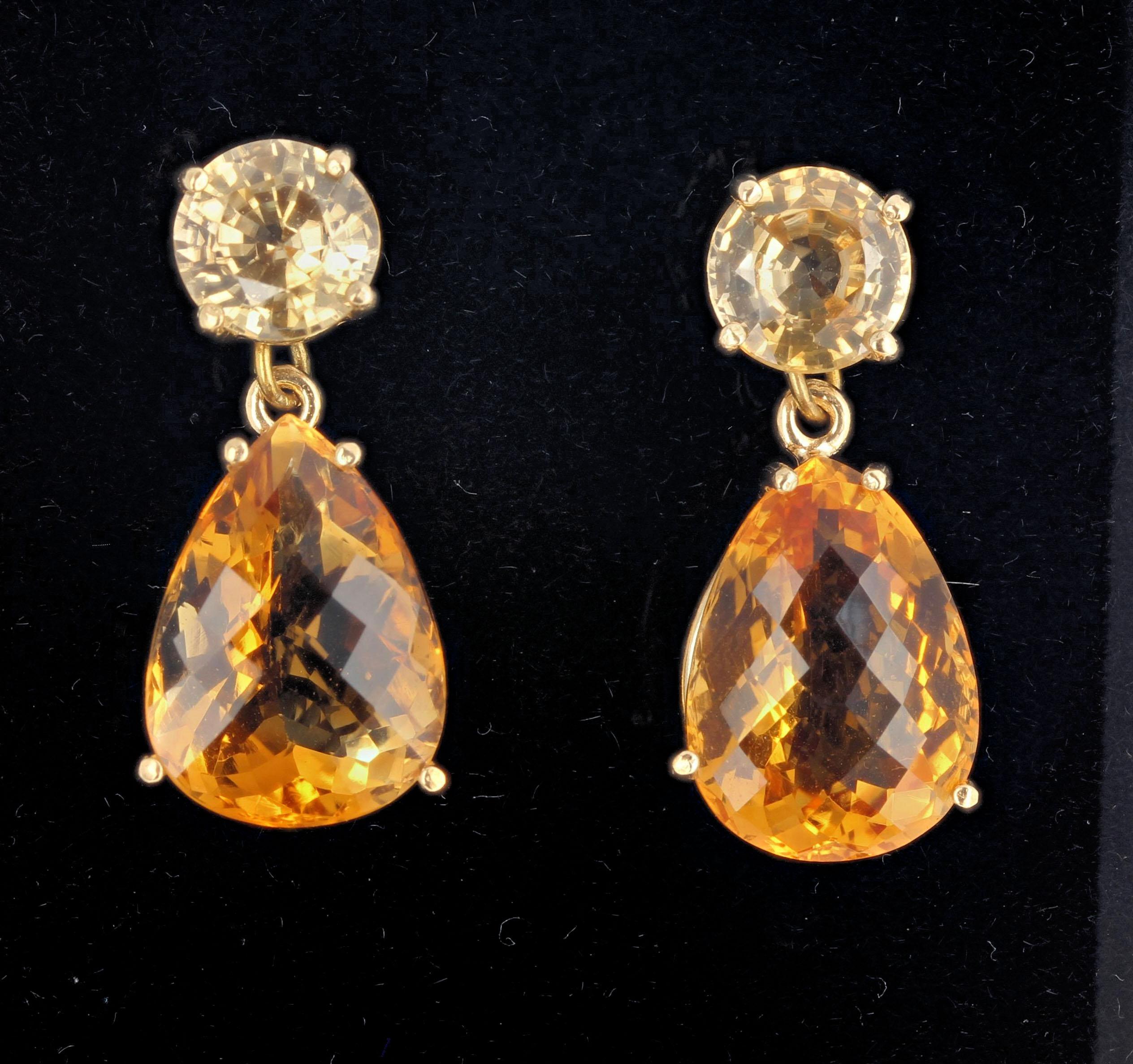 These 15.35 carats of real Citrines dangle elegantly from RARE glittering yellow 5.2 carats of natural real Cambodian Zircons set in 10Kt yellow gold stud earrings that hang approximately 1.1 inches long. These are superbly elegant for dinner and