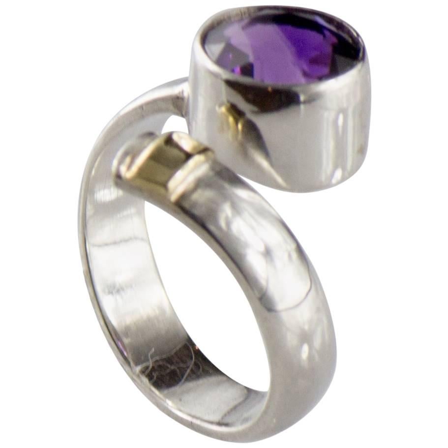 Handmade Sterling Silver and Amethyst Ring. Pinky finger delight! This lovely ring caresses your pinky with its deep purple, round amethyst focal point bezel set in sterling silver to the tip of 14kt yellow gold to enhance the purple.  It was