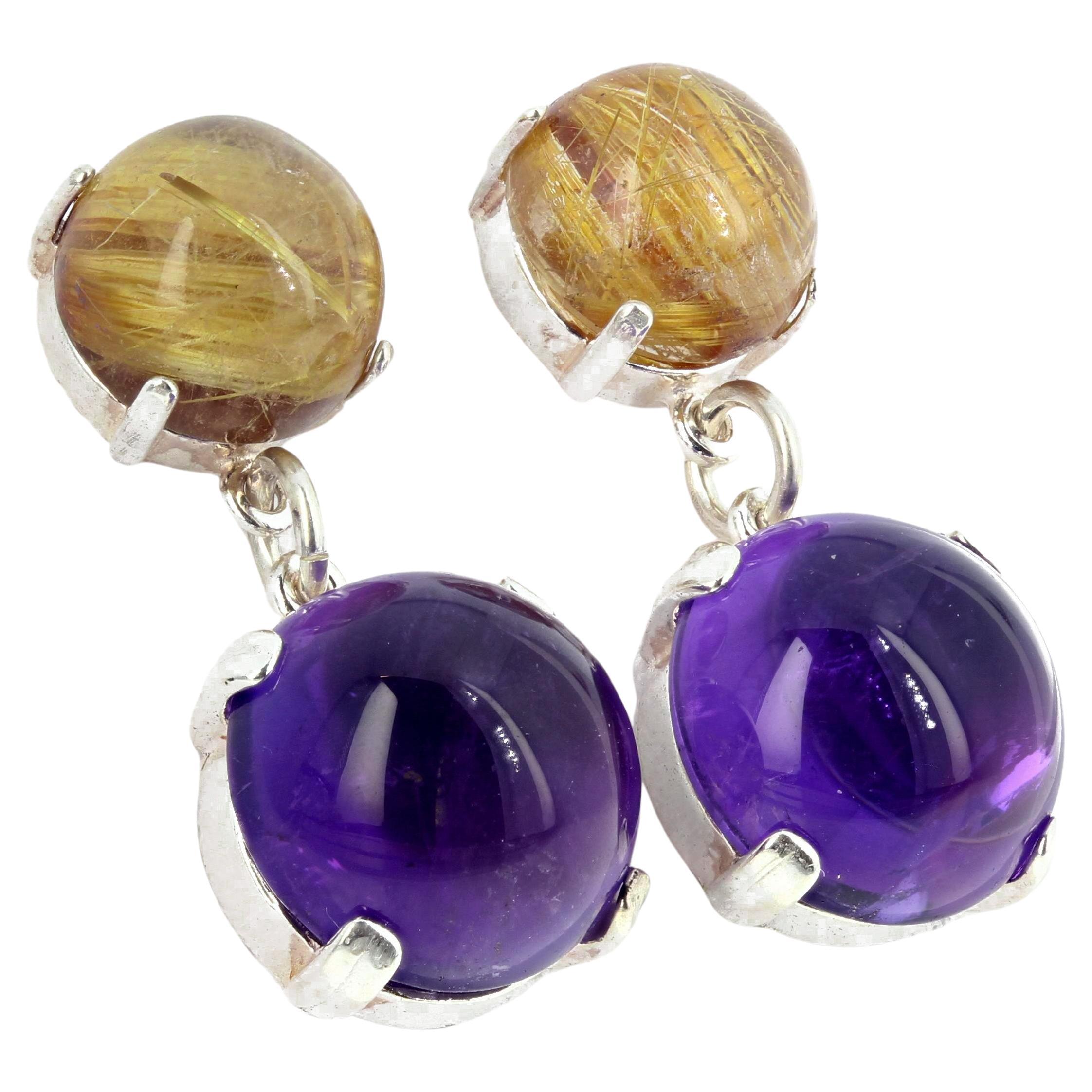 Golden glowing rutilated Quartz dangle round cabochons of glowing Amethysts (4 carats each) on sterling silver stud earrings that hang approximately 1 inch long.  These are stunningly beautiful on your ears. 