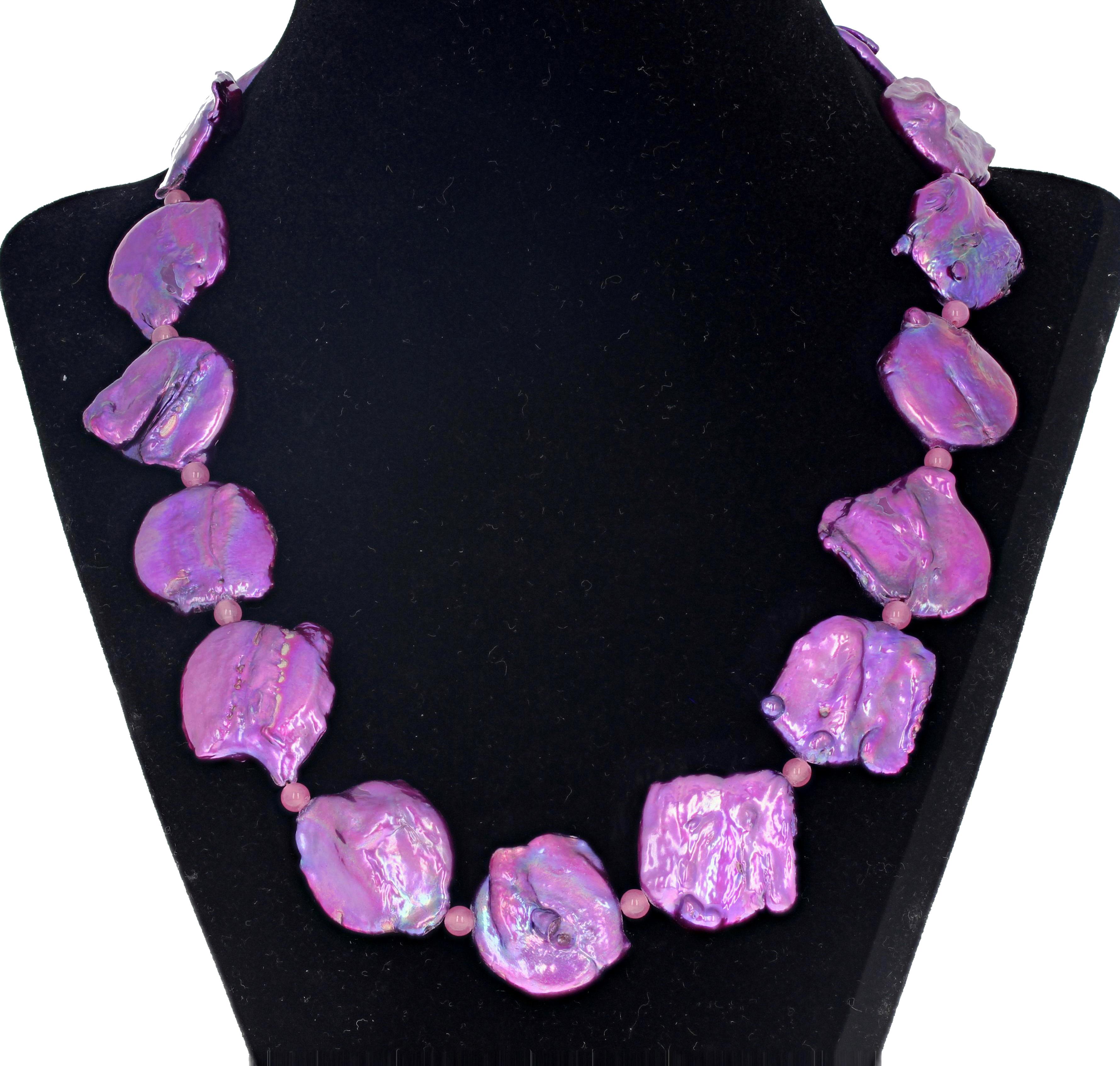 Bright glamorous pinky purple wonderfully unevenly shaped unique artistic Coin Pearls (approximately 20 mm) enhanced with small pink Rose of France Amethysts set with a goldy tone hook clasp.  This is 19 inches long and goes happily to all fun