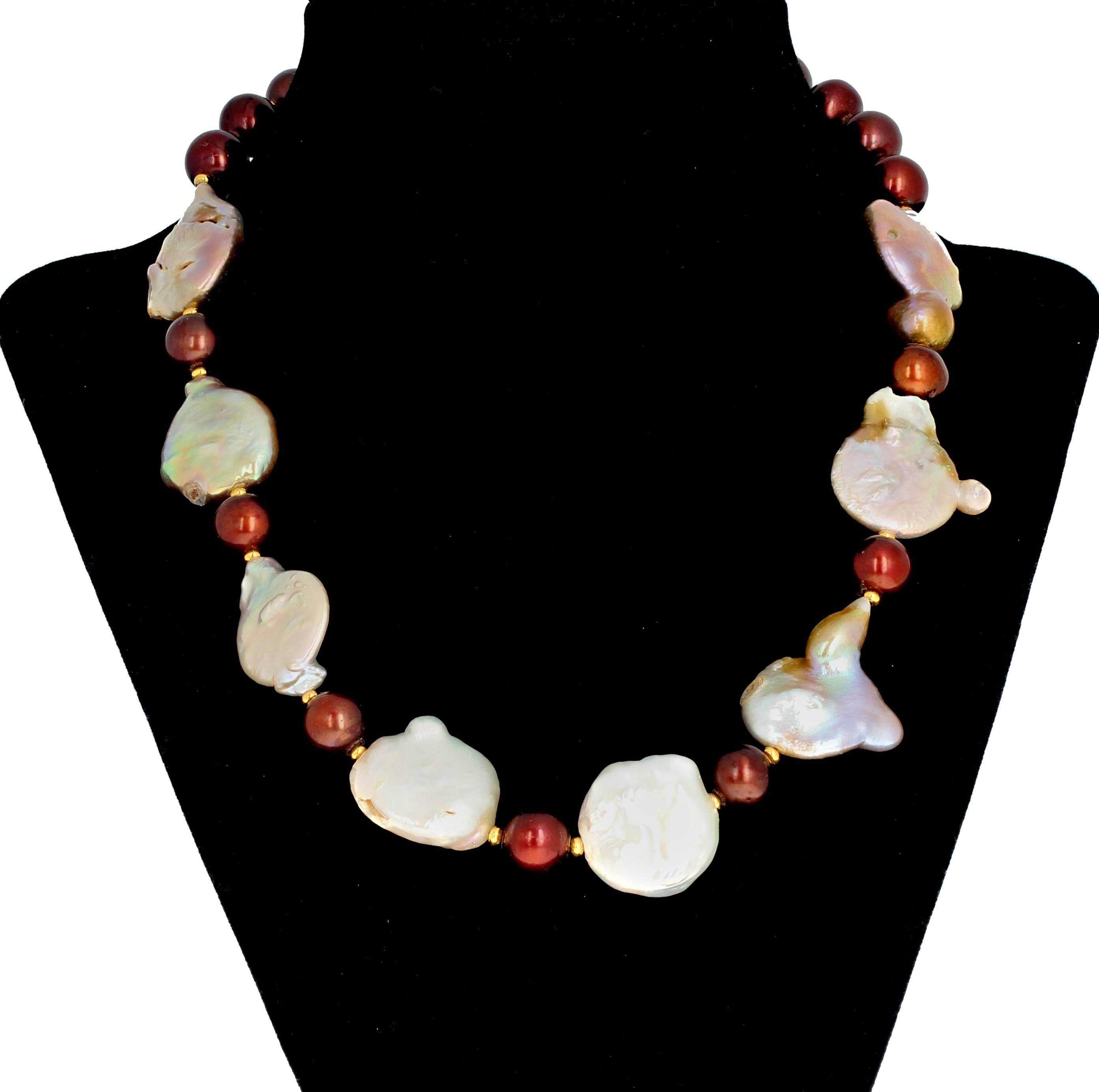 Wonderful lumpy bumpy shaped odd sized real dramatic natural cultured Coin Pearls are enhanced with round coppery color cultured Pearls in this 18 inch long handmade necklace.  The Coin Pearls are approximately 20 mm and the round Pearls are