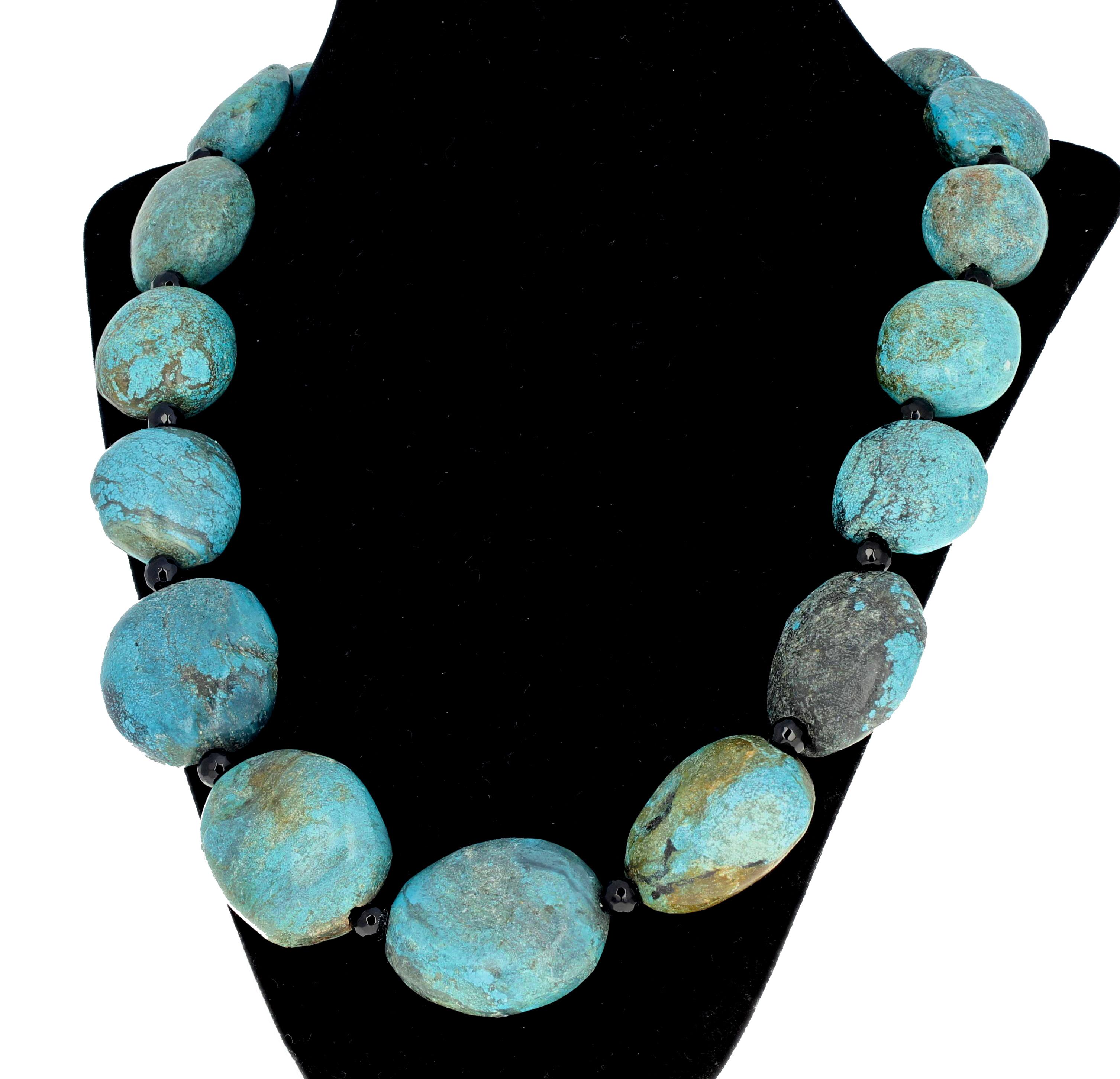 Polished chunks of soft blue natural rare Yai Turquoise rocks enhanced with checkerboard cut gemmy black sparkling Spinel spacers. This measures 23 inches long and the clasp is silver tone hook. 