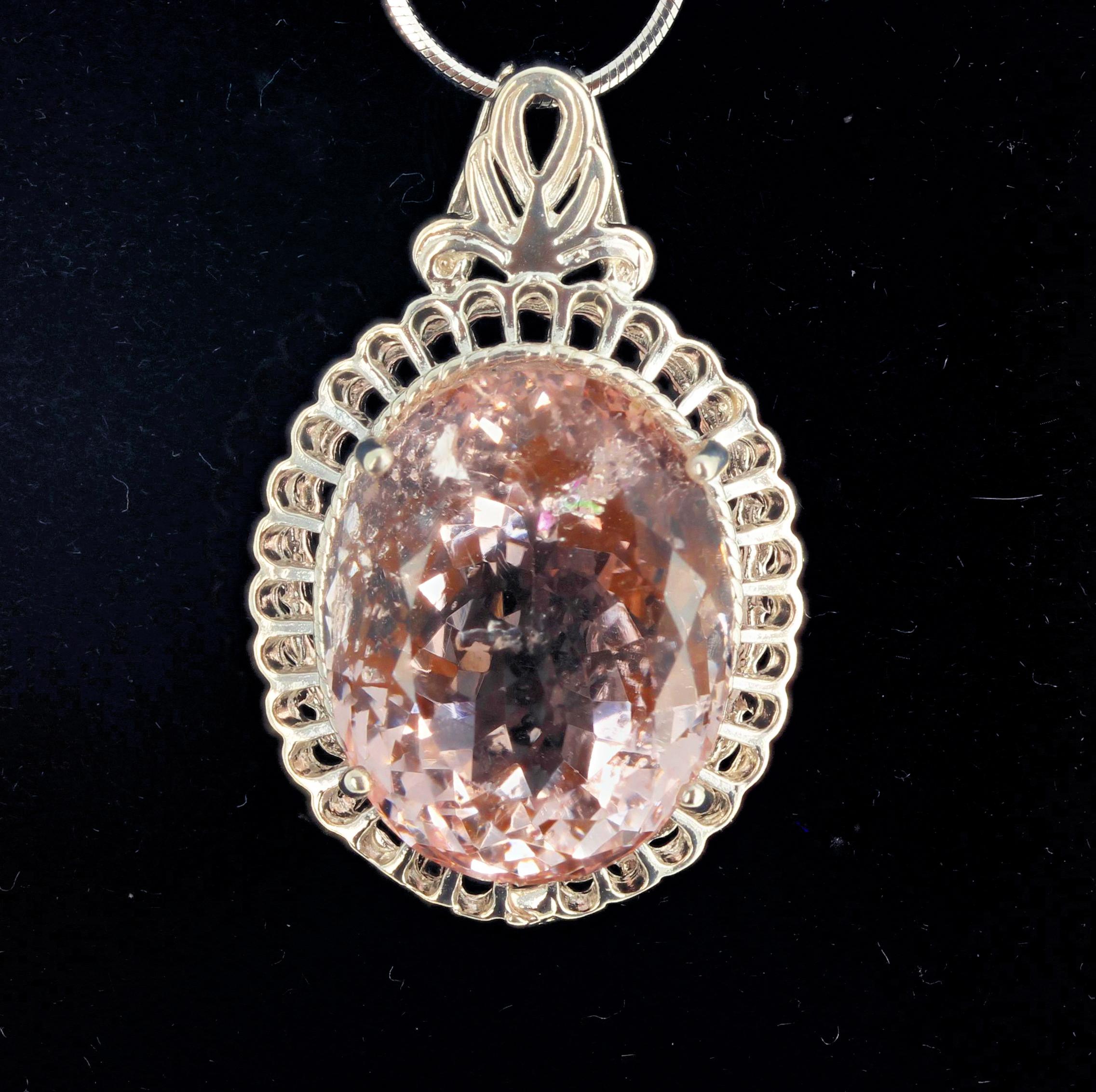 Brilliant rare 29 carat natural Morganite (20 mm x 16 mm) set in a sterling silver handmade pendant.  This hangs approximately 1.7 inches long.  Spectacular optical effect in the Morganite exhibits pinky reflections and fire highlights in spectral