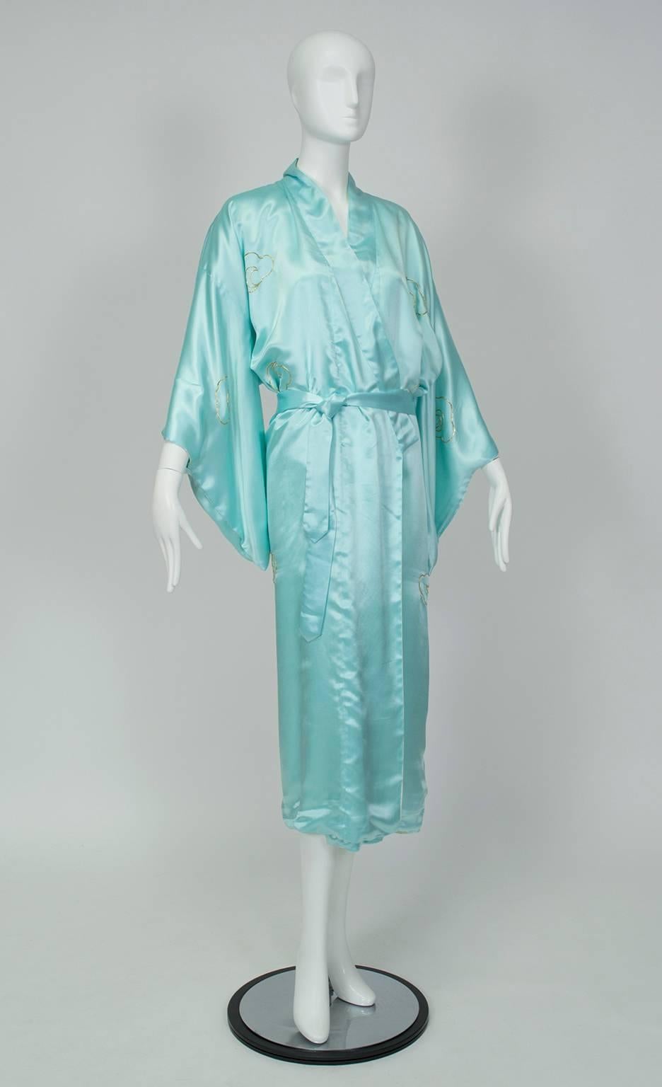 A gift from a Korean War veteran to his wife on his return, this kimono was stored away and never worn because it was “too good.”  Sixty-five years is long enough; time for this dragon to breathe.

Vintage turquoise satin kimono with half shawl