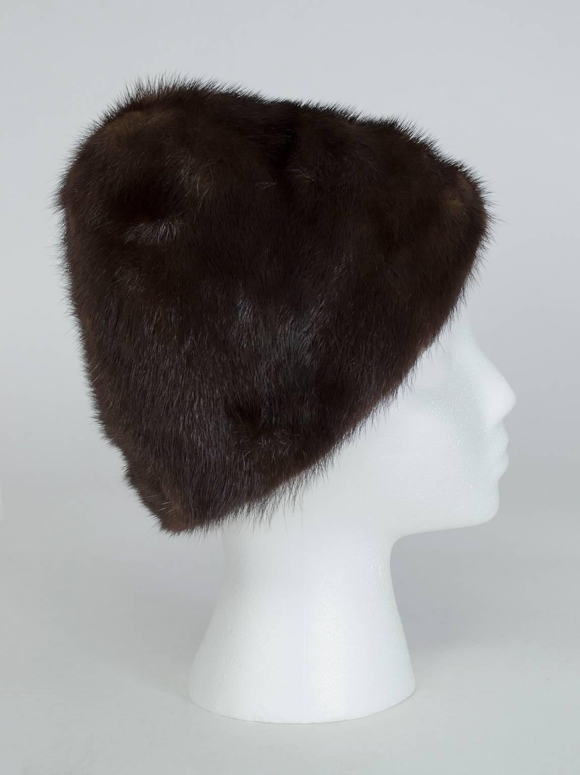 Peak hats immediately conjure the image of a young Audrey Hepburn, and this one is no exception. In supple inky brown (almost black) mink fur, this is a hat that will make you stand a little straighter, walk a little taller, and add a few inches to