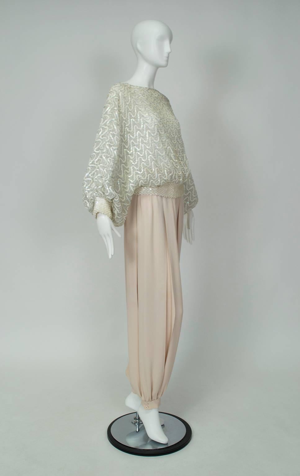As festive and elegant as any party dress but as comfortable as pajamas, this ensemble conjures images of the Arabian Nights while remaining fashionably up-to-the-moment. Its soft, neutral color palette keeps the effect understated despite using