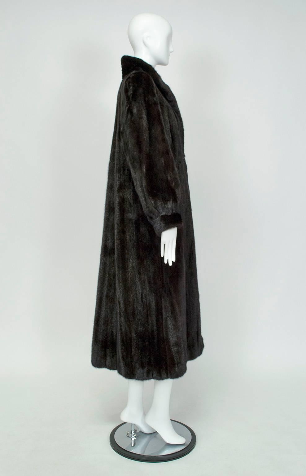 In immaculate condition, this Blackglama ranch mink was purchased in 2006 and worn once. Since then it has been in fur storage, professionally cleaned and glazed, and remains as spectacular as it was the day it was bought. The shawl collar and
