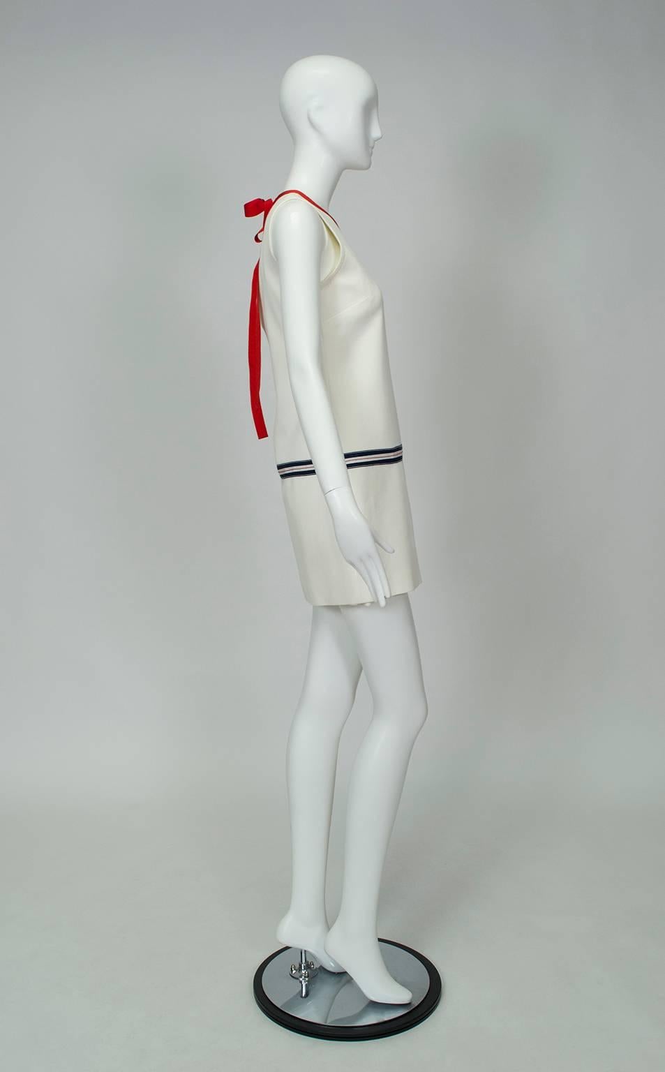 Reminiscent of the A-line mini dresses of the Mod Era, this frock is perfectly suited for showing off a great pair of legs (or white go-go boots, if you dare!). Its minimalist design and red, white and blue ribbon waist trim will carry you from