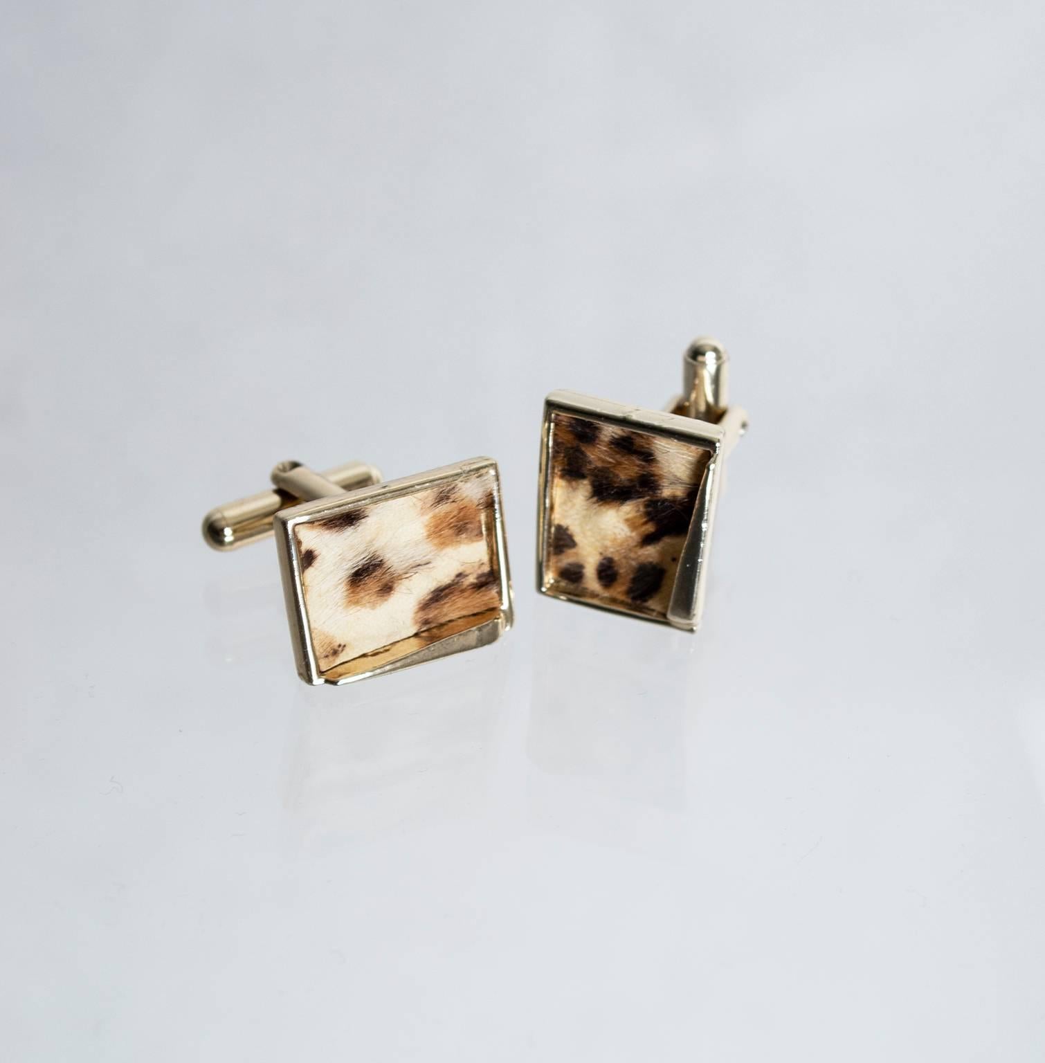 The perfect accompaniment to your slim-lapel suits and skinny ties, these iconic cuff links are the sartorial equivalent to a 2-martini lunch. The best part? They’re pony hair so they’re fuzzy too!

Goldtone metal toggle cuff links inset with