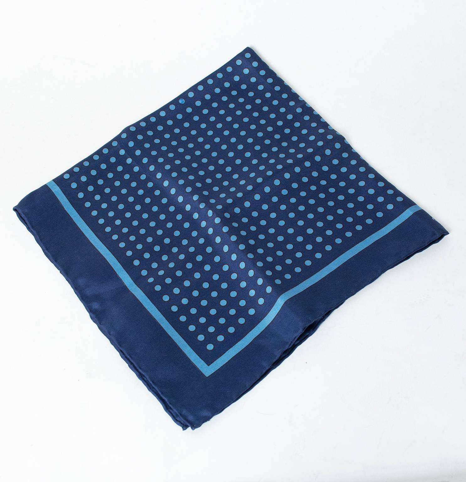 Elegant and understated, this pocket square is a must-have in any well-dressed gentleman’s wardrobe.  Practically begs to be worn strolling a cobblestone street in Milan.

Navy silk pocket square with marine blue border and micro polka dots; hand