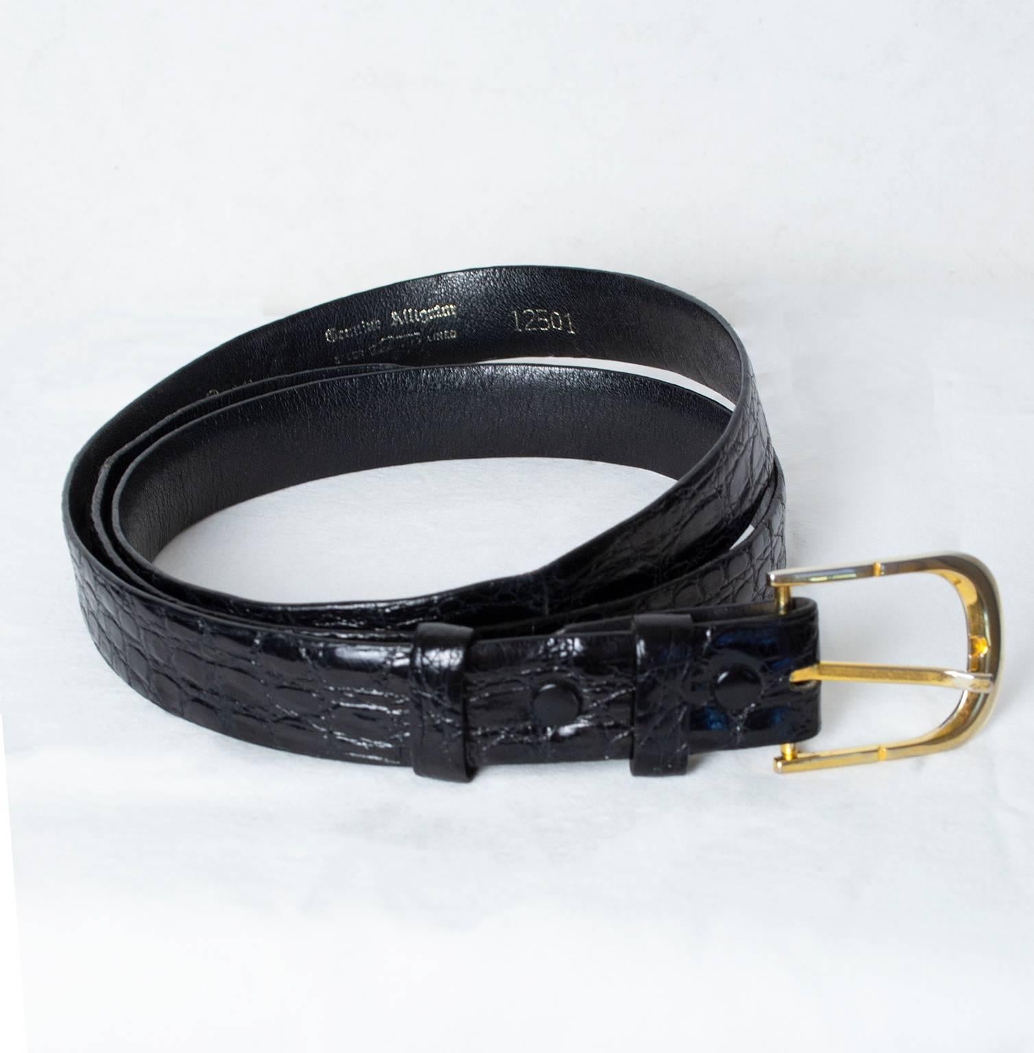 With two snaps that allow you to replace the buckle, this rich alligator skin belt changes with your wardrobe while still remaining timeless. As reliable as your favorite watch.

Vintage black alligator leather belt with removable slimline goldtone