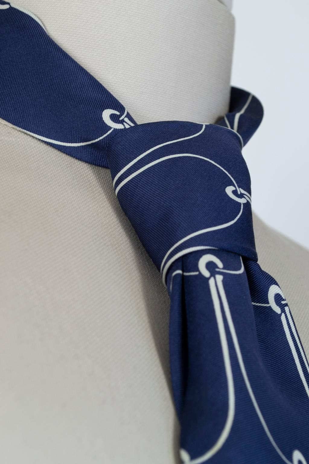 For those of you who must work but would rather be sailing, here’s an elegant necktie that will keep your eyes on the prize while you get through your day.

Navy silk necktie with repeating ivory fish hook print.


fabric: silk twill
noteworthy: 