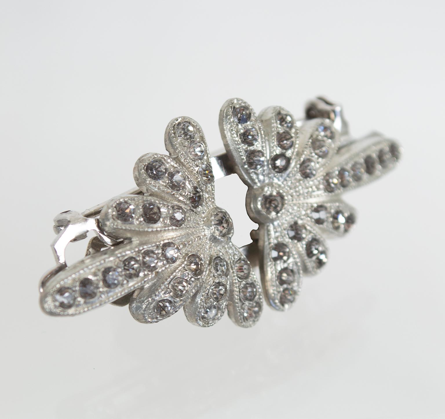A patented design, this stunning Art Deco brooch comes apart so its pieces may also be used as dress clips. Brains AND beauty? A double threat.

Art Deco brooch featuring a radiating ovoid starburst decorated with minuscule marcasite stones; pieces