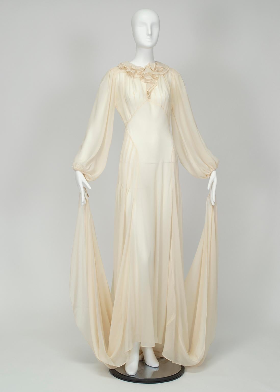 Without question, one of the most exquisite bridal gowns we have ever seen. Despite its 4 ½’ cathedral train, it is lighter in weight than most gowns half its length thanks to its whisper-light silk chiffon fabric. And with billowing bishop sleeves,