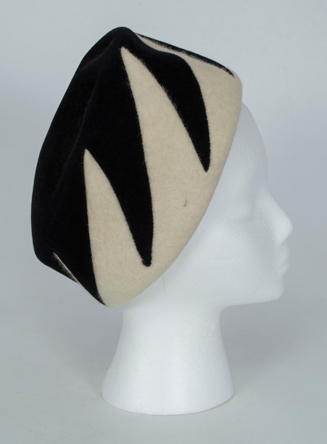 With enough boldness to silence a room and a neutral, pair-with-anything color palette, its existence is reason enough to start wearing hats again. Isabella Blow would approve.

Round pillbox turban of black doeskin and ivory felted wool; ivory