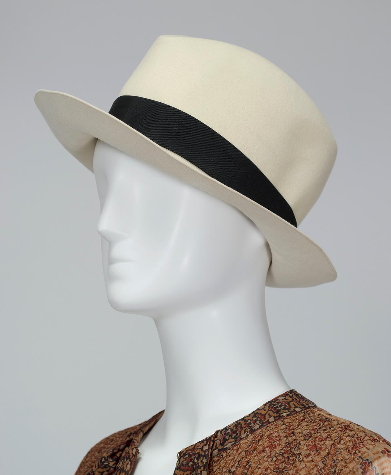 Crushable, packable and stylable in multiple ways, this fedora is the saucy gal's alternative to the boho floppy hat. Its light color, super luxe hand and jet black grosgrain band keep it seasonless and neutral, so it will go with anything