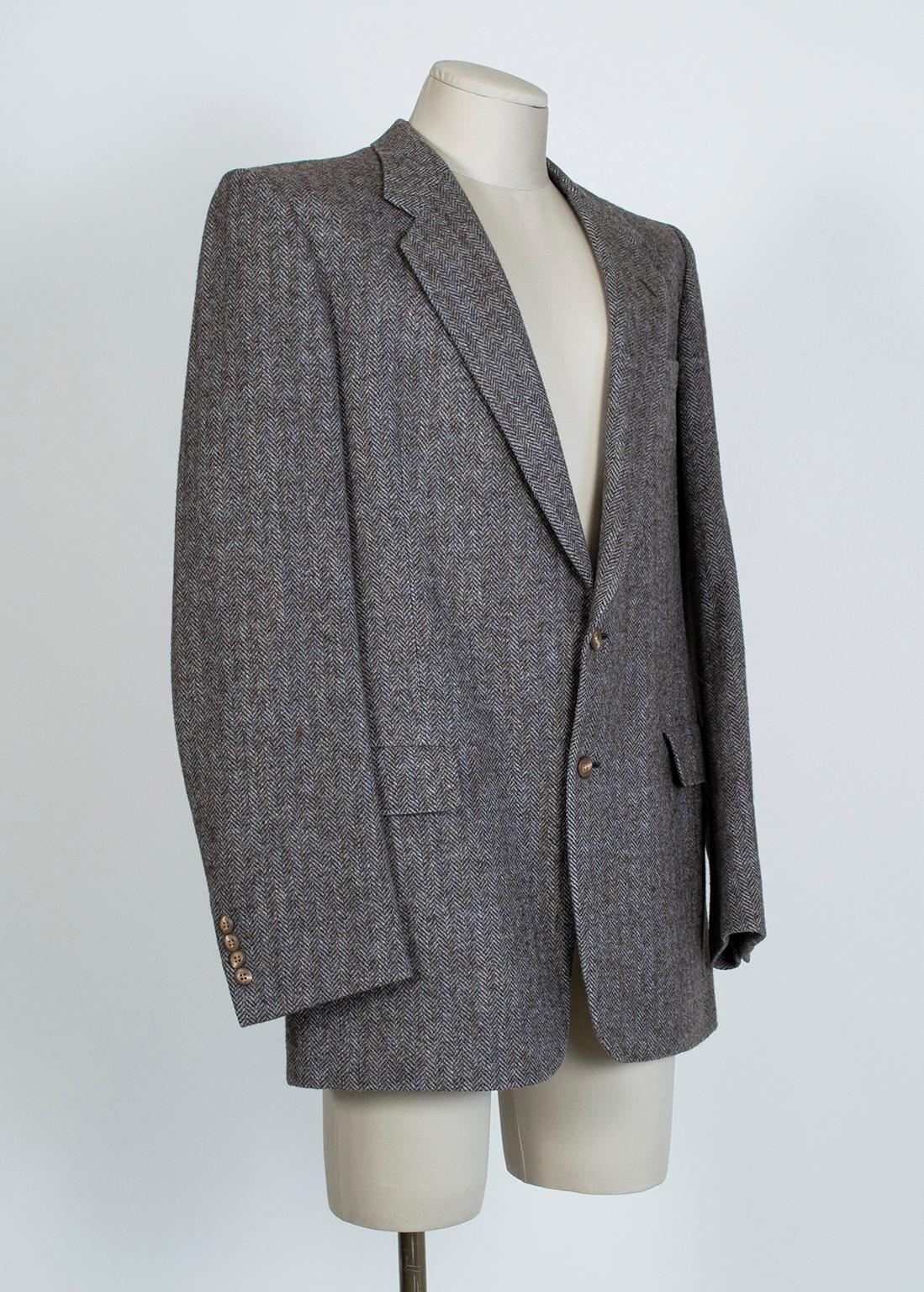A wardrobe essential for a well-dressed man, a herringbone sport jacket is like an old friend who will never let you down. This one, with its impressionist combination of gray, brown and blue, pairs beautifully with a multitude of colors and