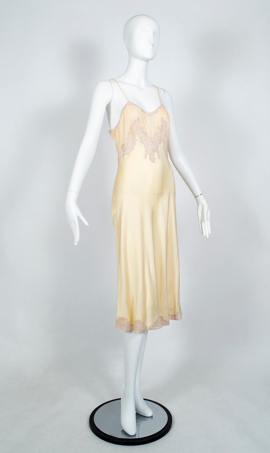 A featherweight wisp of two different kinds of silk, this bias cut chemise is still opaque enough to be worn as a dress if desired. We adore how the inset lace forms a fetching criss-cross at the bust, precisely where the pintucks--which are