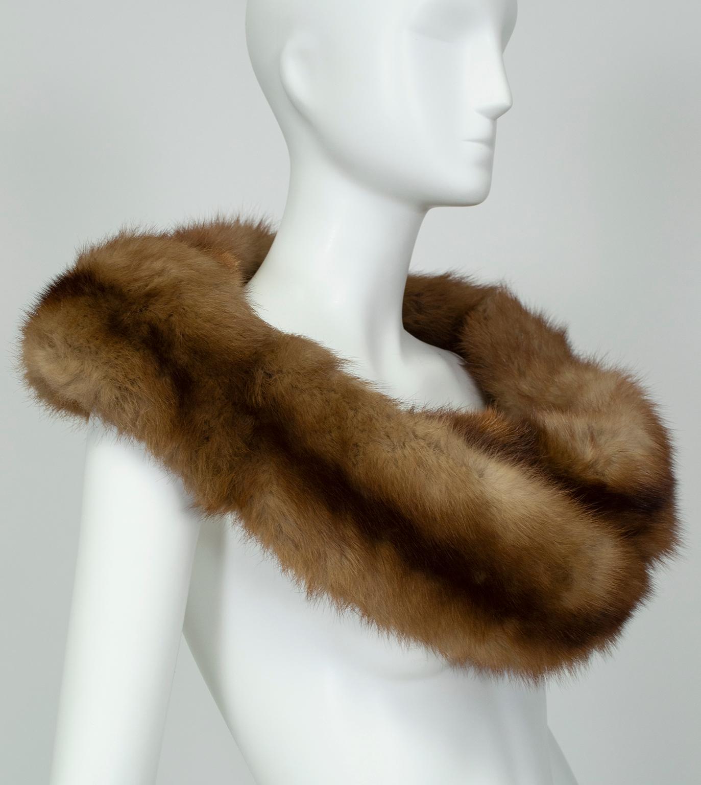 As timeless as a set of pearls, fur shoulder cowls convey ladylike elegance and remains essential-wearing with strapless dresses. The braided feature on this piece permits a variety of uses: clasp around shoulders as a wrap, tuck one end through