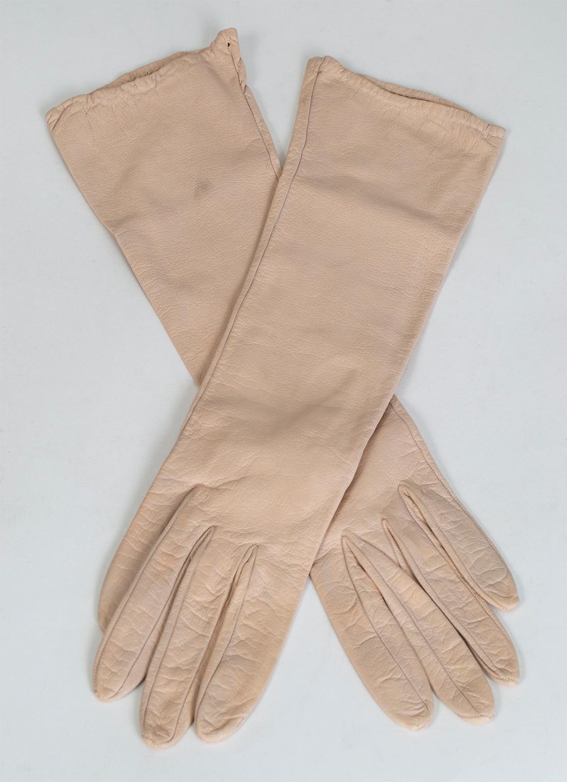 Nothing elevates evening wear like a second-skin leather glove, especially one in an unusual color. This mid-forearm length pair offers both an elegant, atypical shade and a silk lining for warmth during the chilly winter arts season and winter