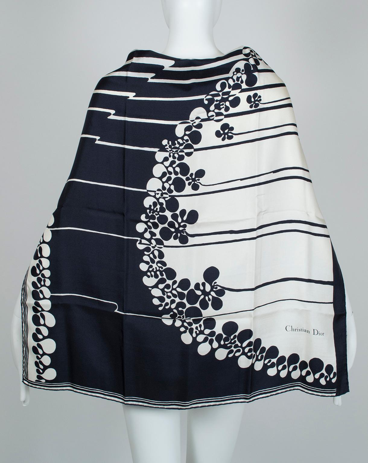 Stark black and white lines and curves embellish this oversized square scarf, large enough to wear around the shoulders, in the hair or on your handbag. Pretty enough to frame!

Single-ply silk twill scarf with rolled edges. Square format features