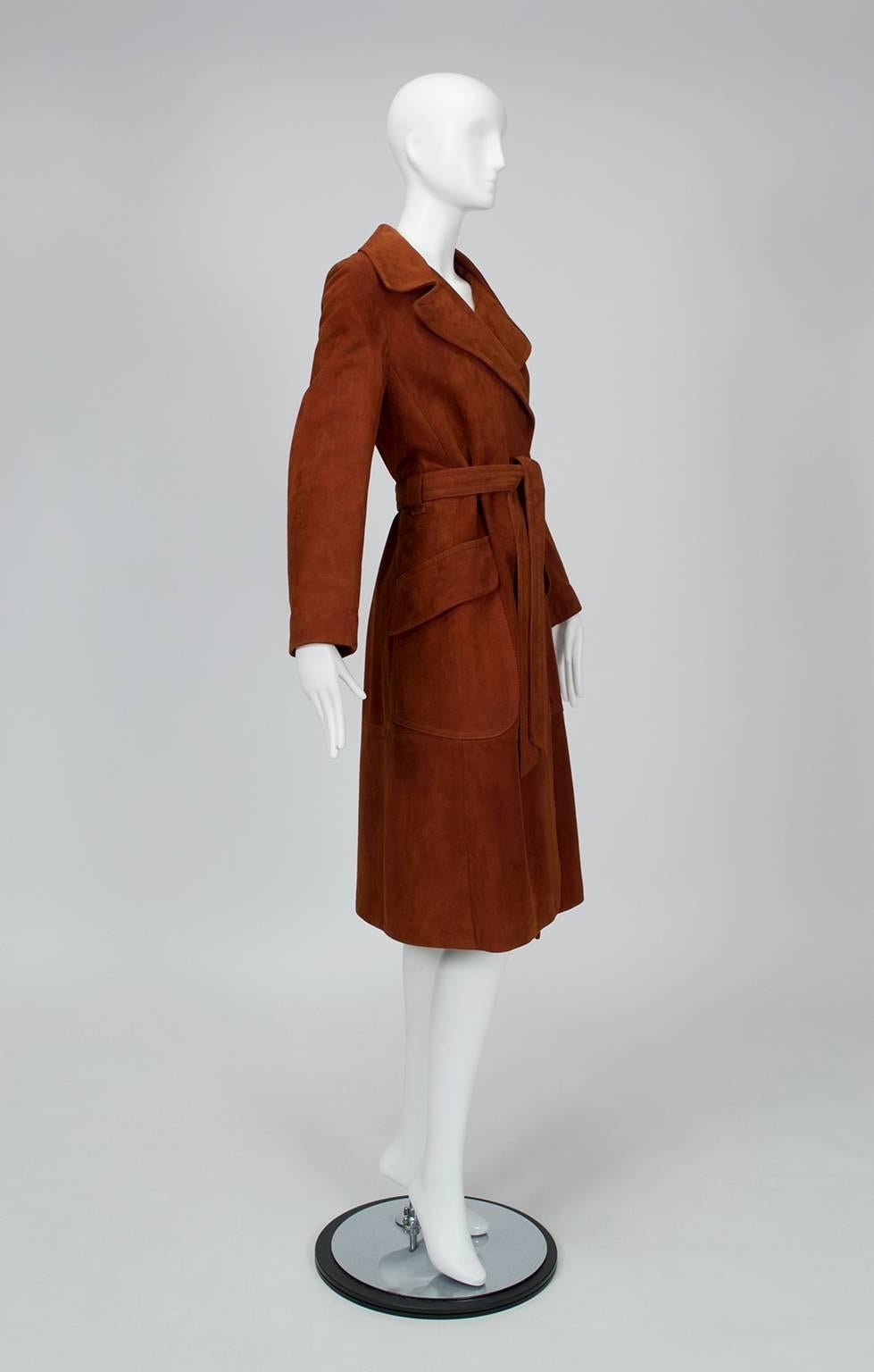With its buttery texture, spicy color and bohemian details, this timeless trench coat vibrates with "rich hippie" goodness. Pair with a floppy brim hat and channel Angelica Huston during her Jack Nicholson days.

Vintage midi-length