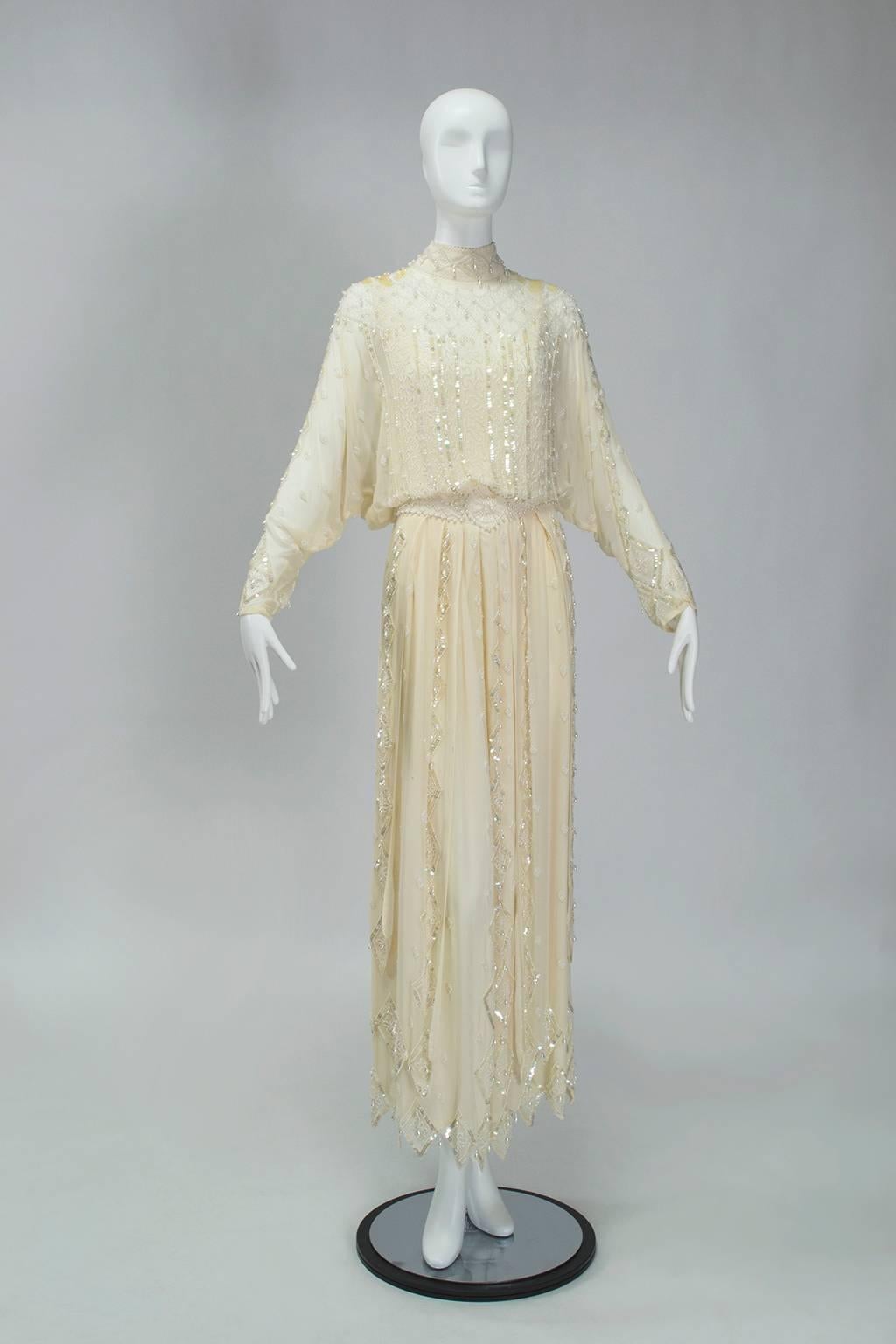 Though produced in the 1980s this gown has all the hallmarks of a turn-of-the-century tea gown, including a layered handkerchief hemline, high neck and opulent ornamentation. A sturdy and wearable (but still dramatic) alternative to an